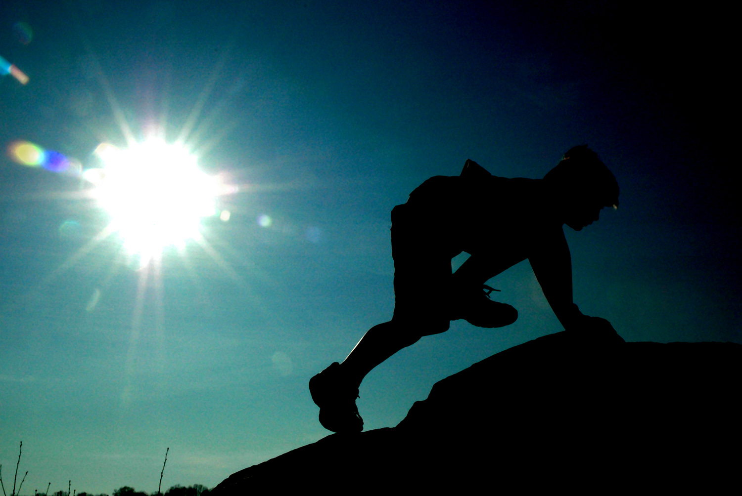 Boy_Free_Rock_Climbing_Scrambling_Silhouette_Bright_Sun.jpg