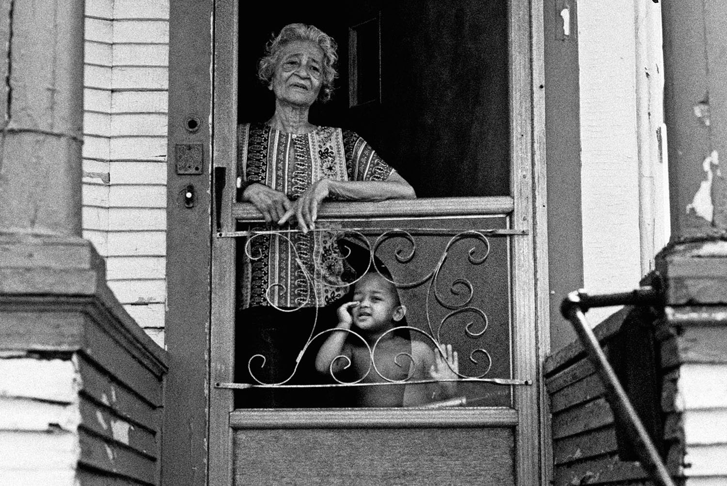 African_American_Old_Woman_Grandson_Poverty_Doorway_Black-and-White.jpg