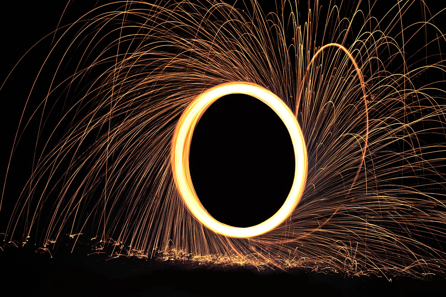 Spinning_Steel_Wool_Fire_Sparks_Long_Exposure_Light_Painting_Night.jpg