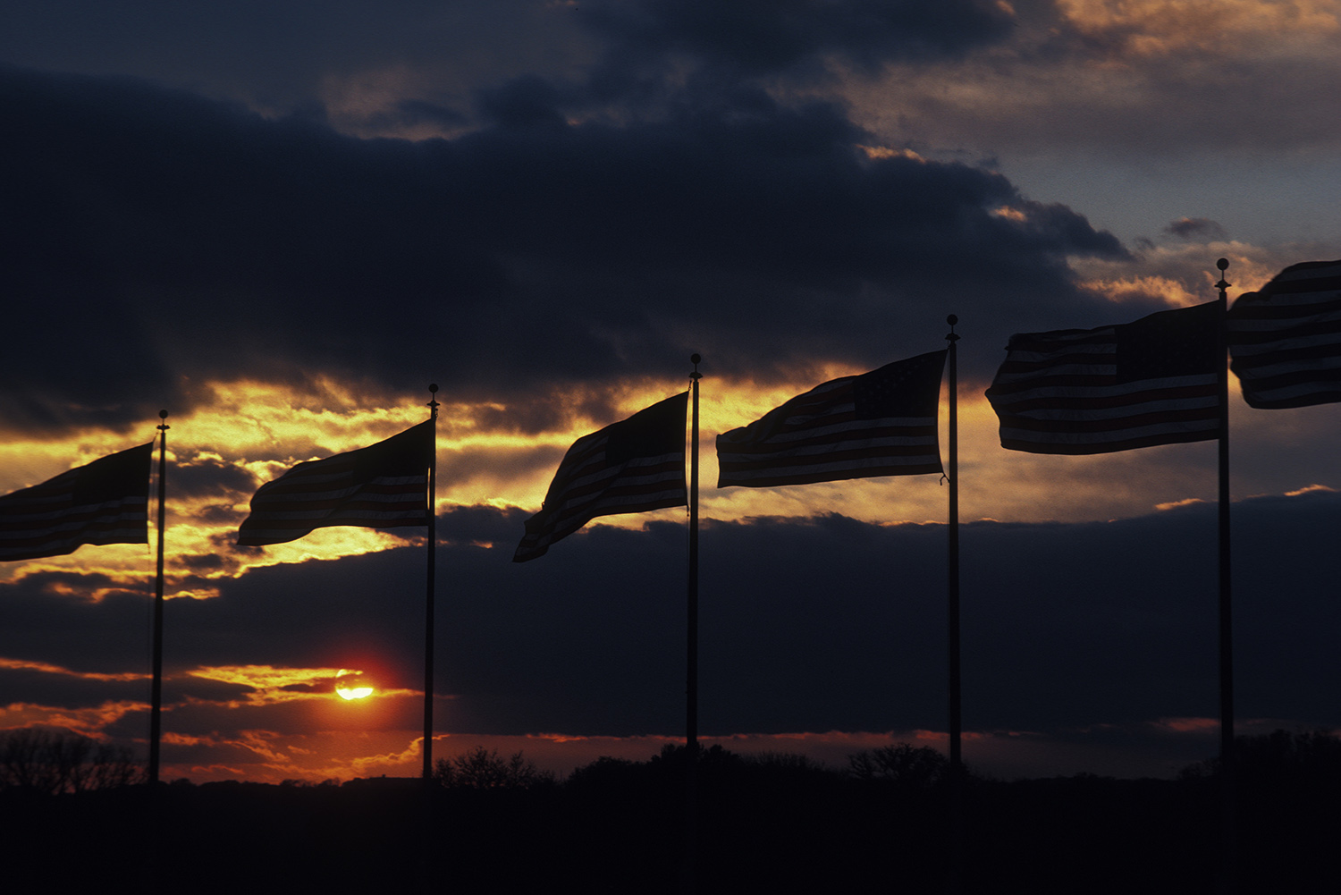 United_States_Flags_Washington_Monument_Grounds_Sunset_Clouds_Patriotic.jpg