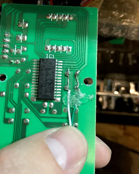 Leads soldered to the power button contacts. Little hot snot to keep things in place.