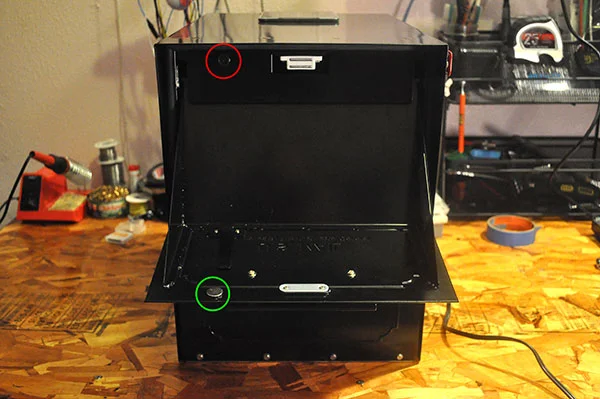 Red circle is the delivery reed switch. The green circle is the delivery door magnet.