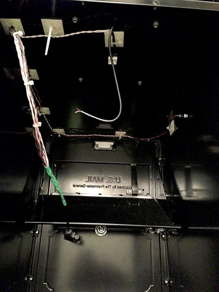 You can roughly see how the wires were run in this pic. The retrieve switch wire is hot-glued into the right corner. You can also see the right notification LED and the dome light (white square in the center) that was added for giggles.