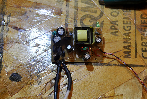 Eeeek! a naked wall-wart! Notice that I added some leads to for HV and LV.
