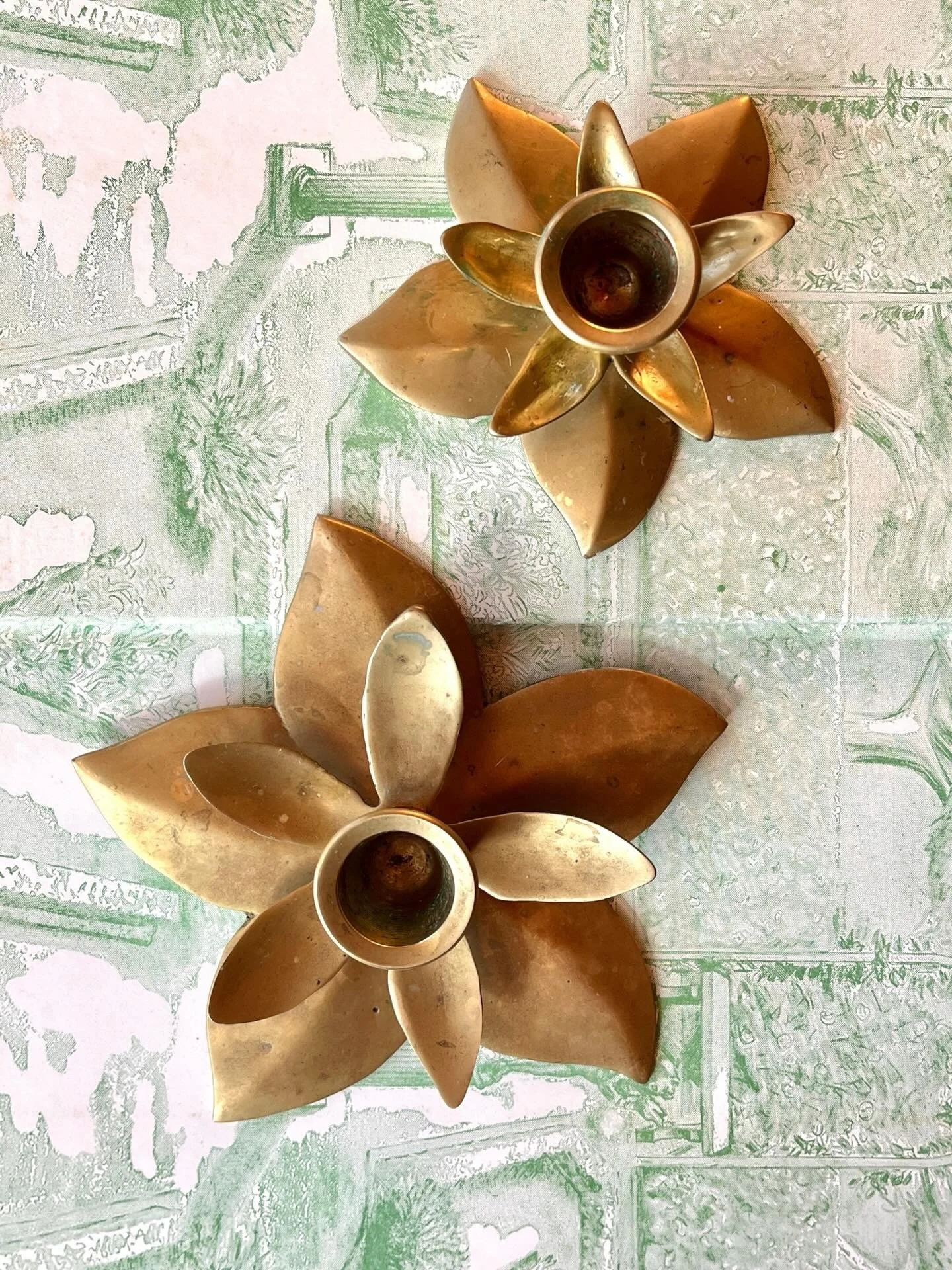 Vintage brass lotus flower candlesticks.  Available in my online shop. Link in bio.