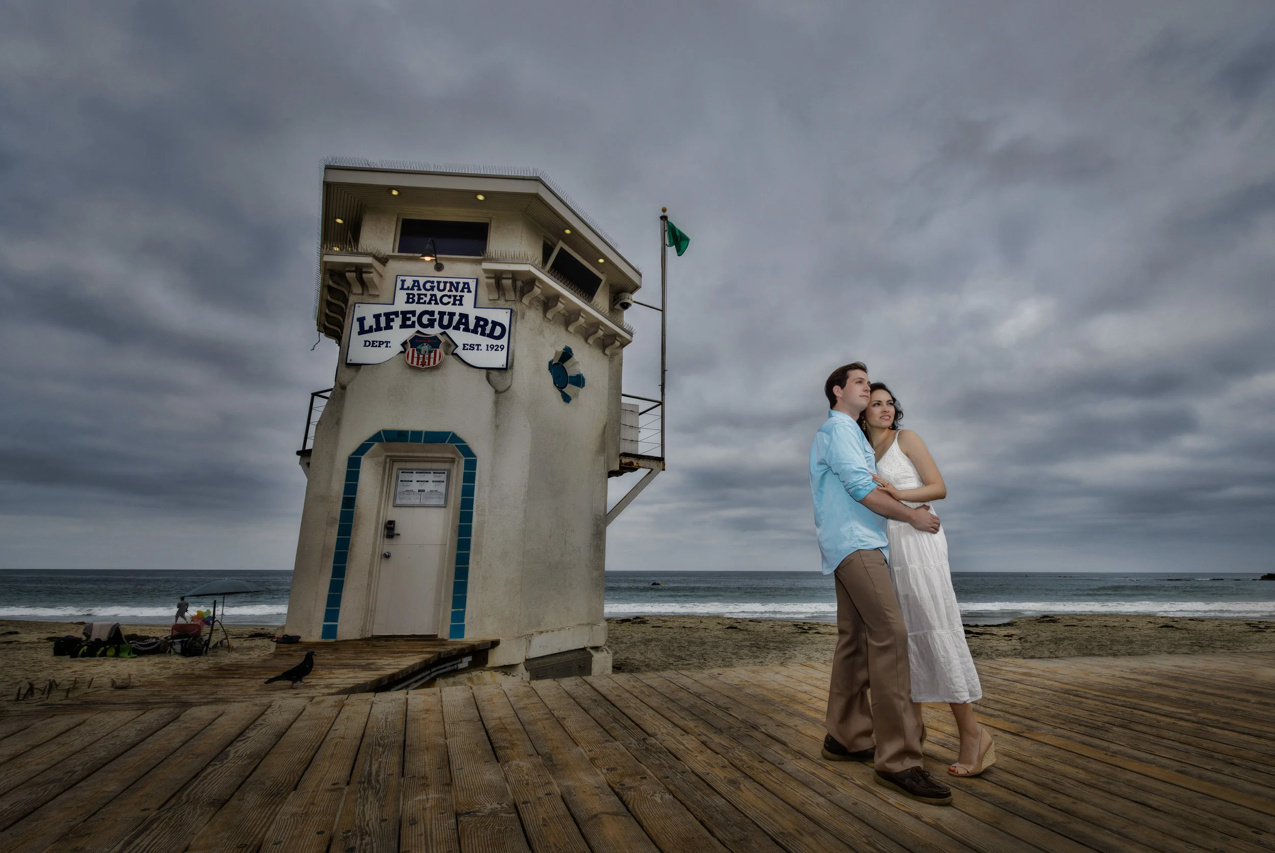 Engagement Couple in Laguna Beach By Lifeguard Tower
