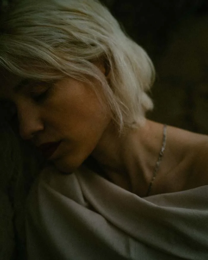 Sad woman feeling shame, self sabortage and sadness looking at the ground