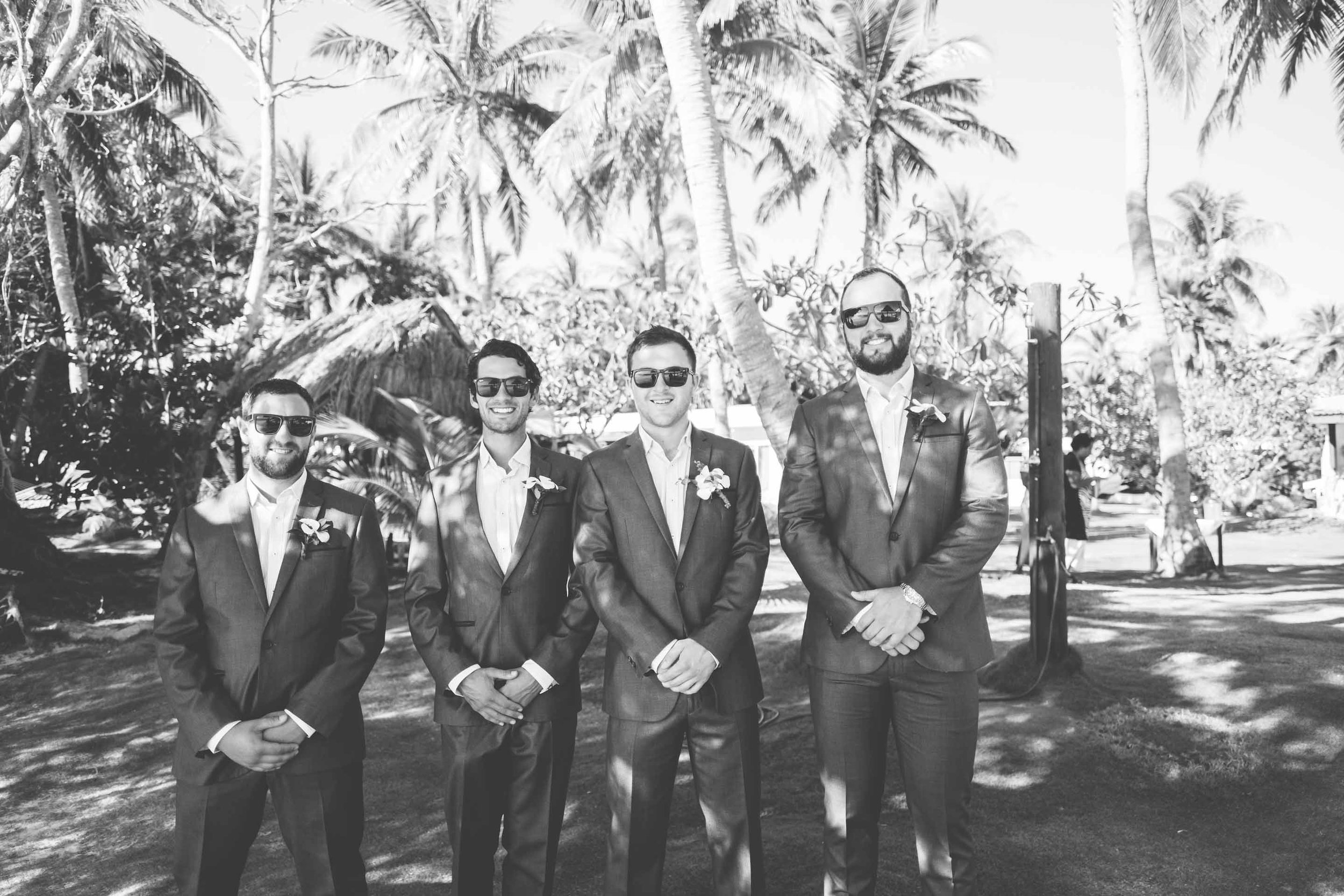 the groom with his groomsmen waiting at the ceremony venue