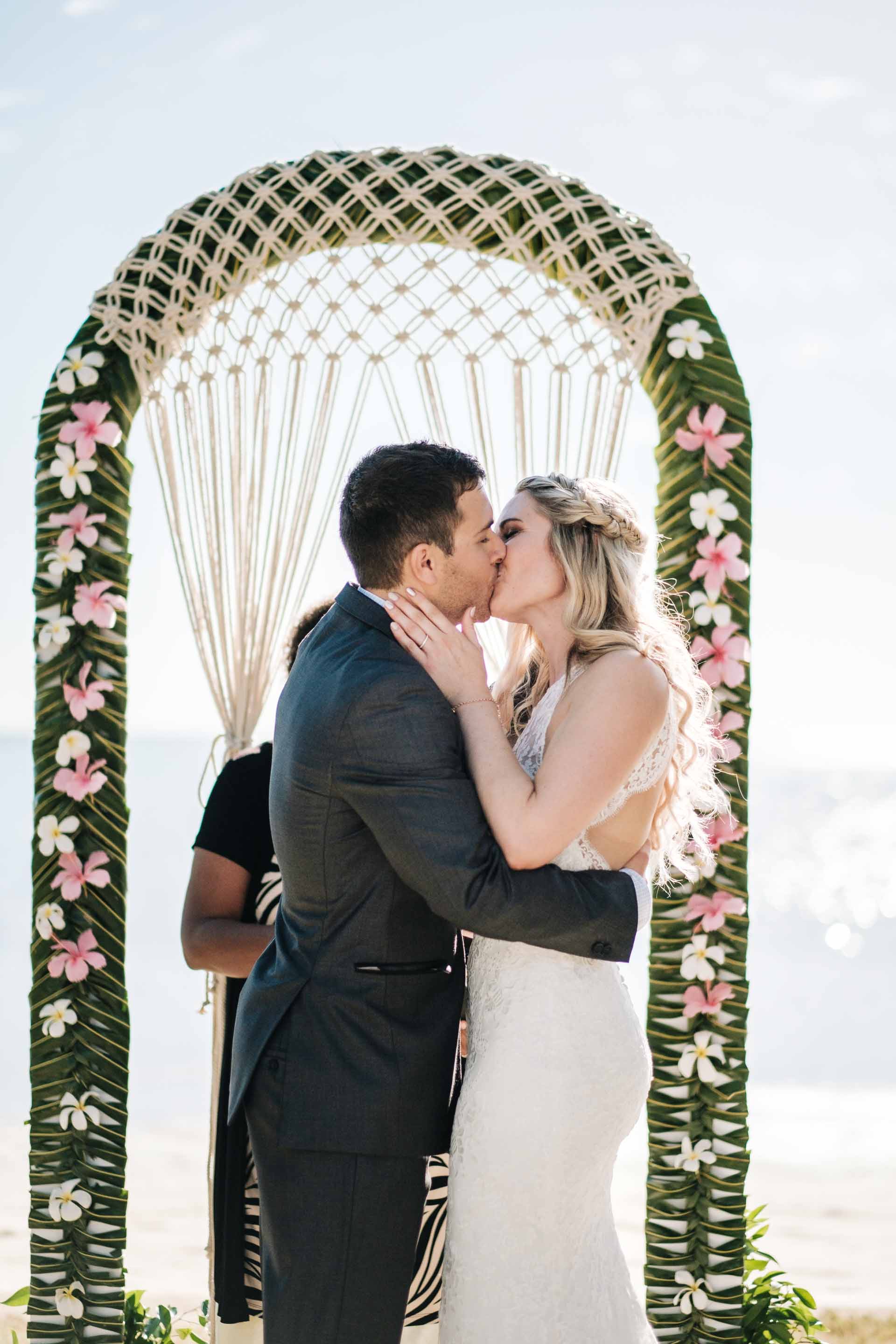 bride and groom share their first kiss as husband and wife