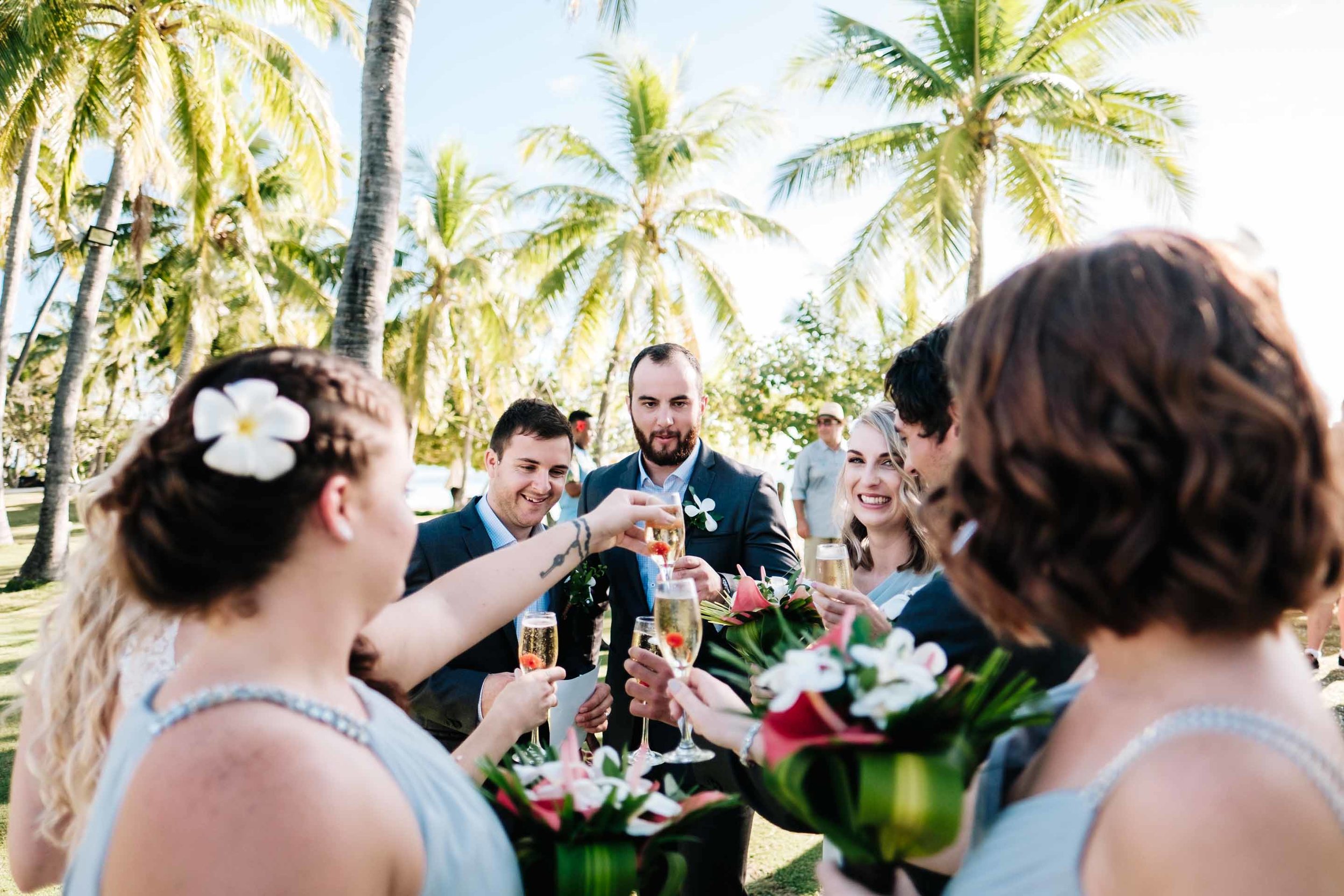 the bridal party celebrate with champagne after the ceremony