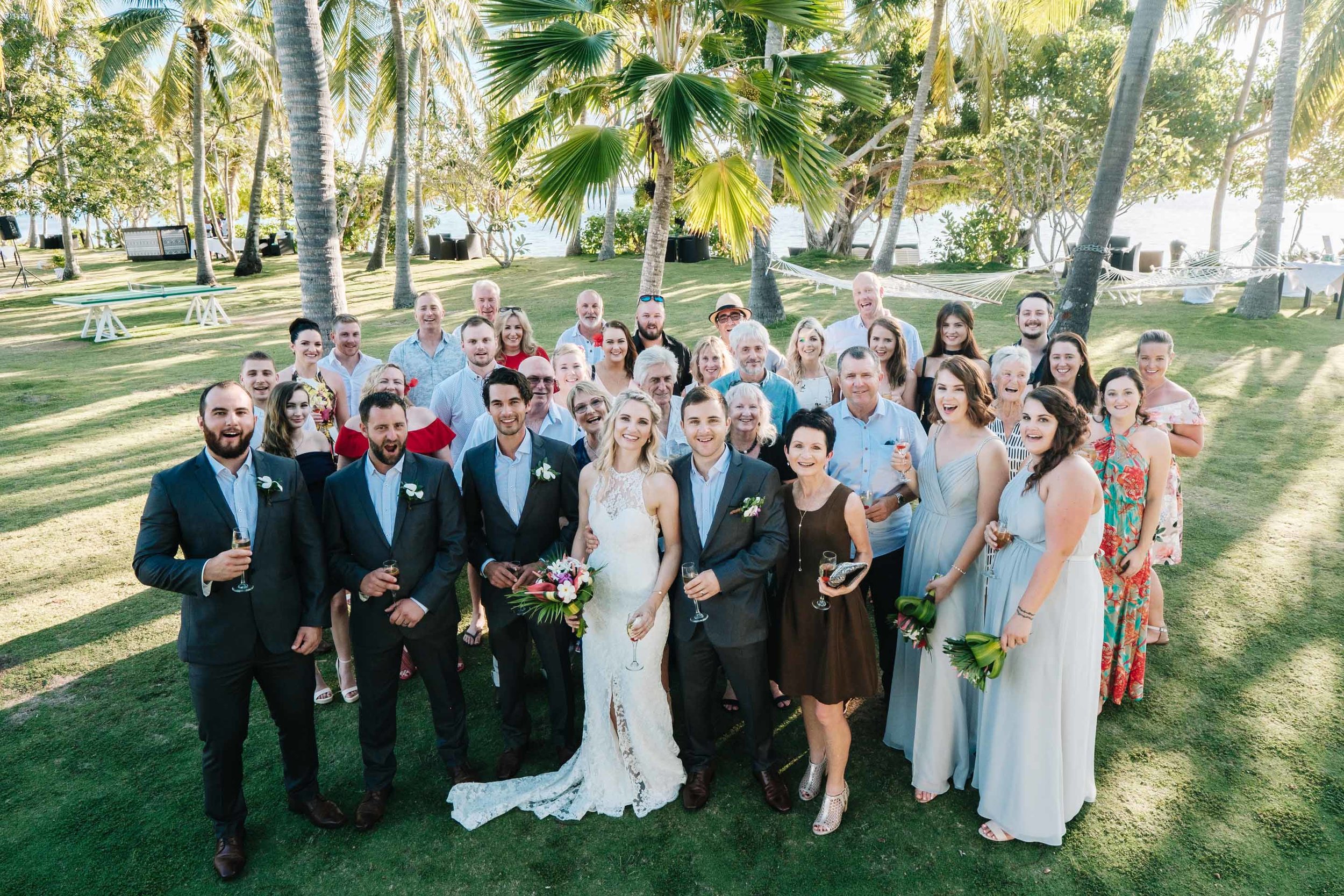 all the guests together in a group photo after the ceremony