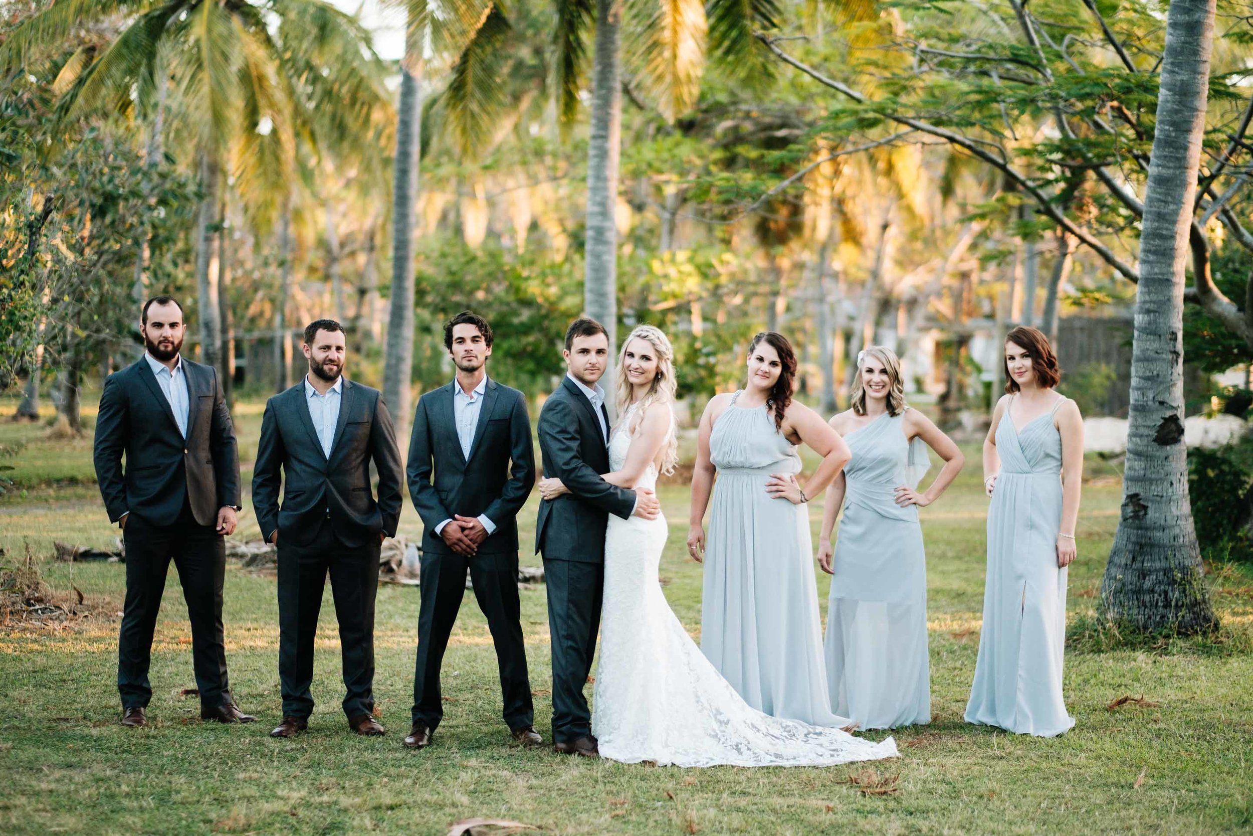 the bridal party together in the grounds behind Lomani Island Resort