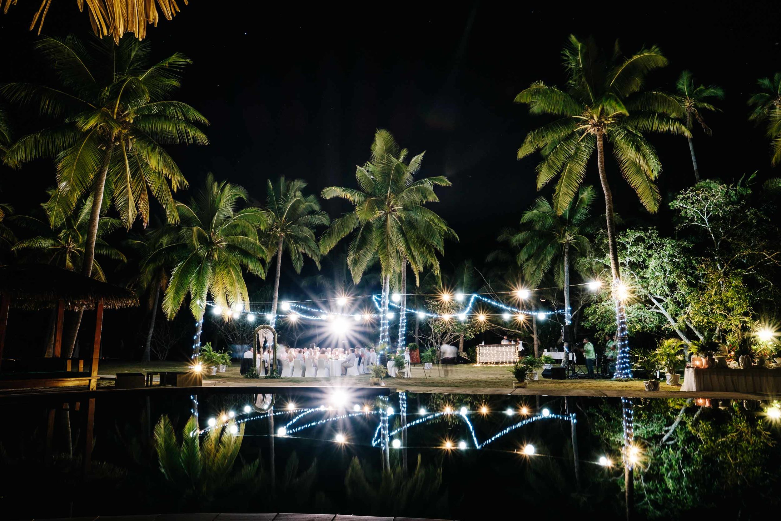 the beautiful outdoor reception reflected in the pool