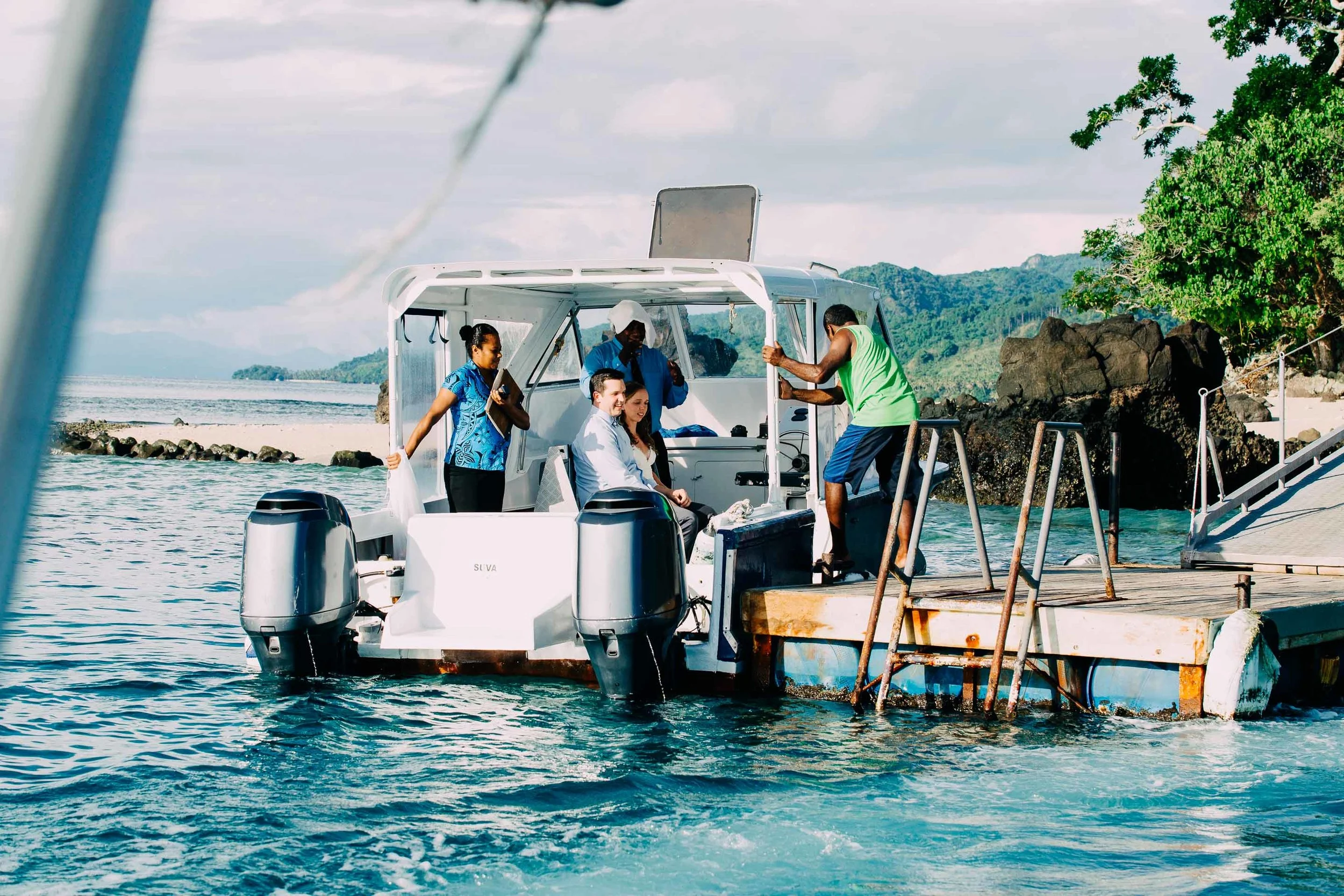 Bride groom and staff of Royal Davui Island board the speedboat to venture out to the sand bank.