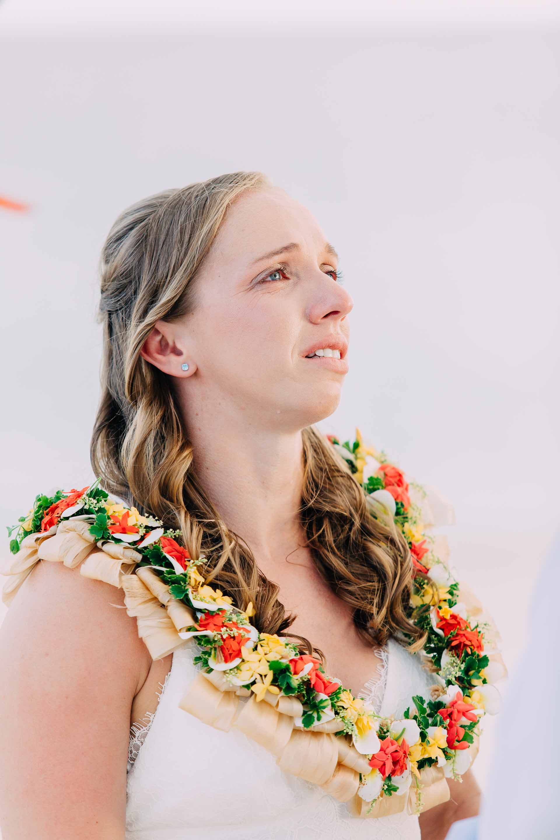 An emotional bride says her vows during her Fiji sand quay wedding