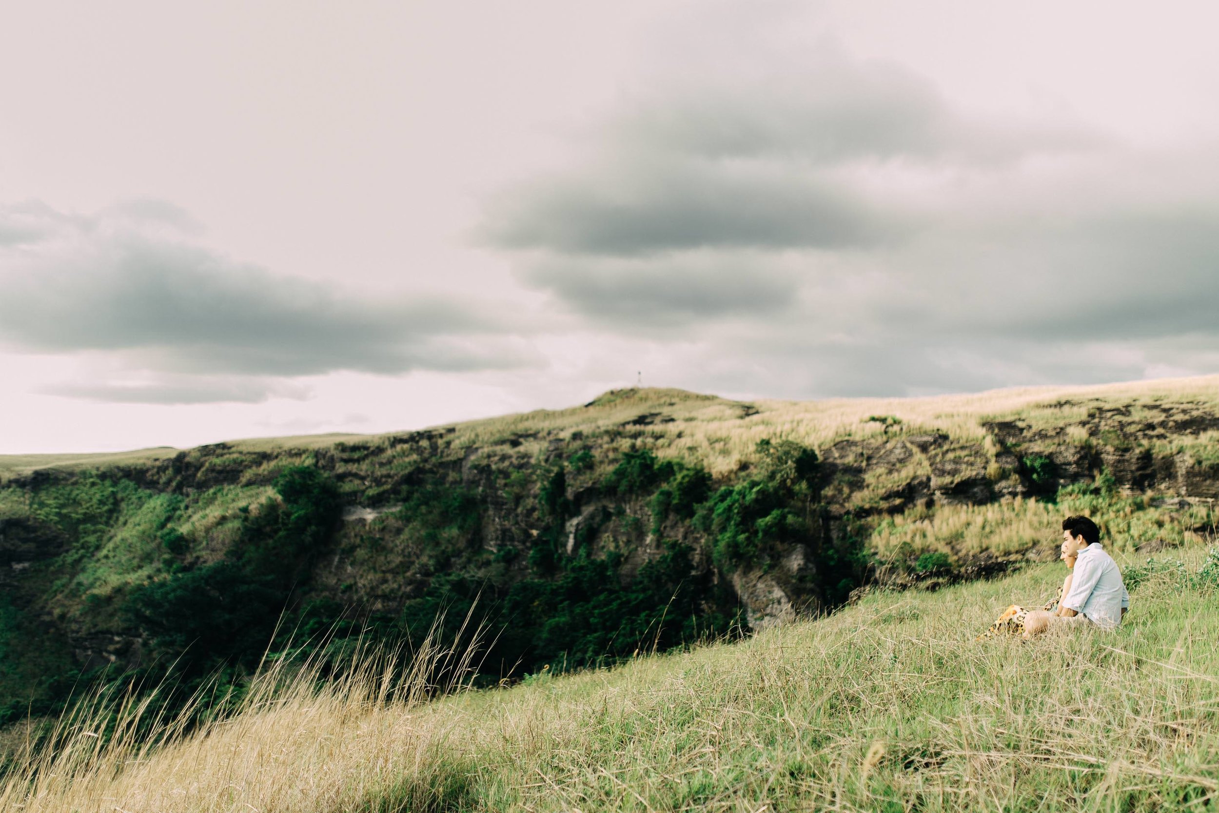 enjoying the view from tall grass on the mountain side