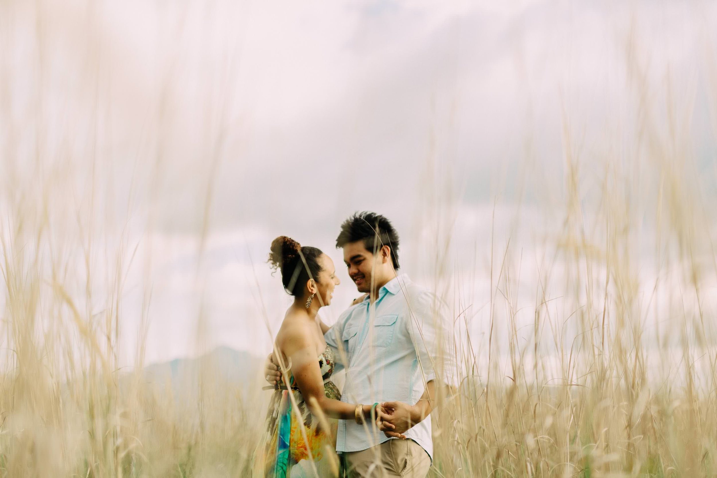 the couple sharing a light moment during their engagement session