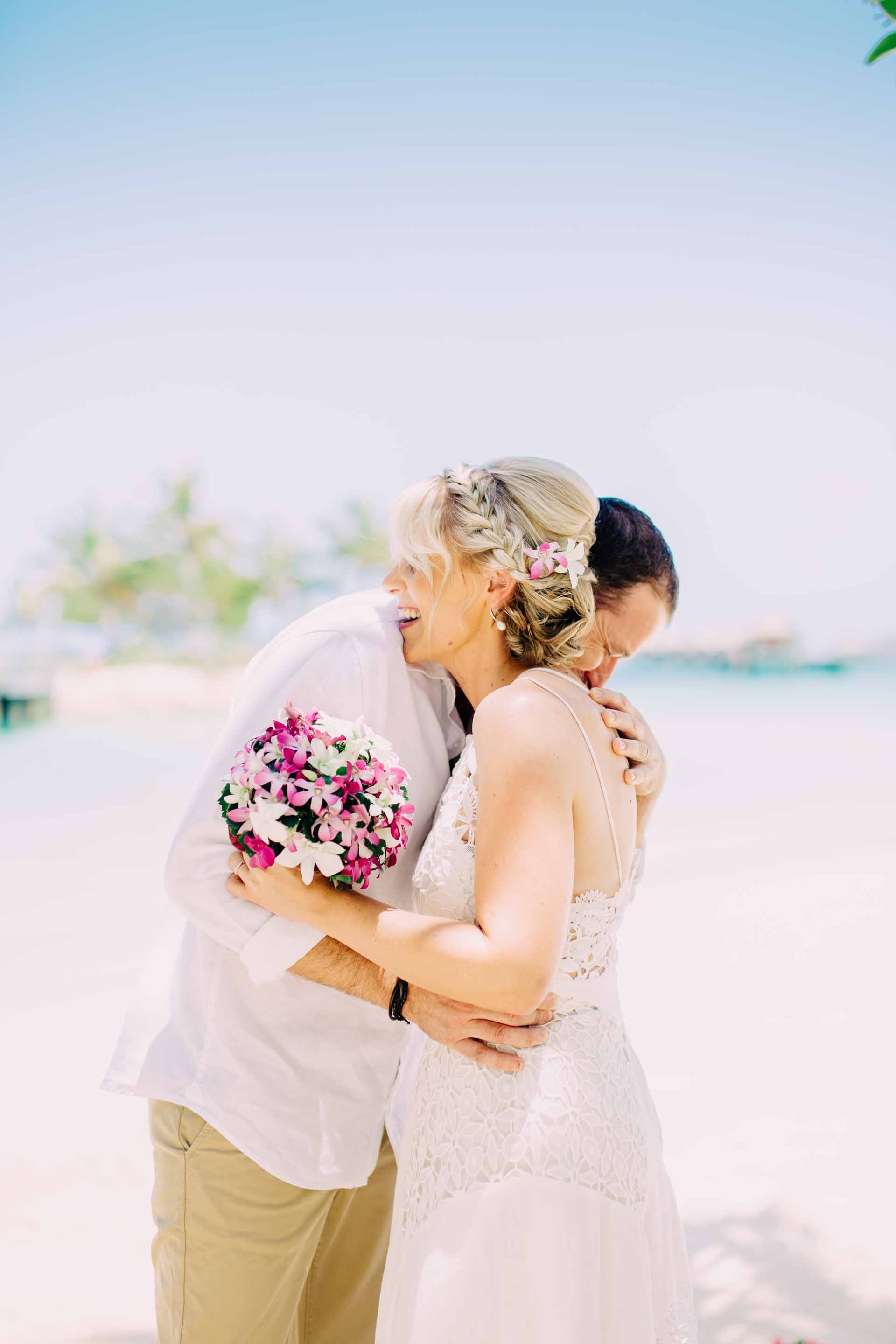 the couple hug after being proclaimed husband and wife