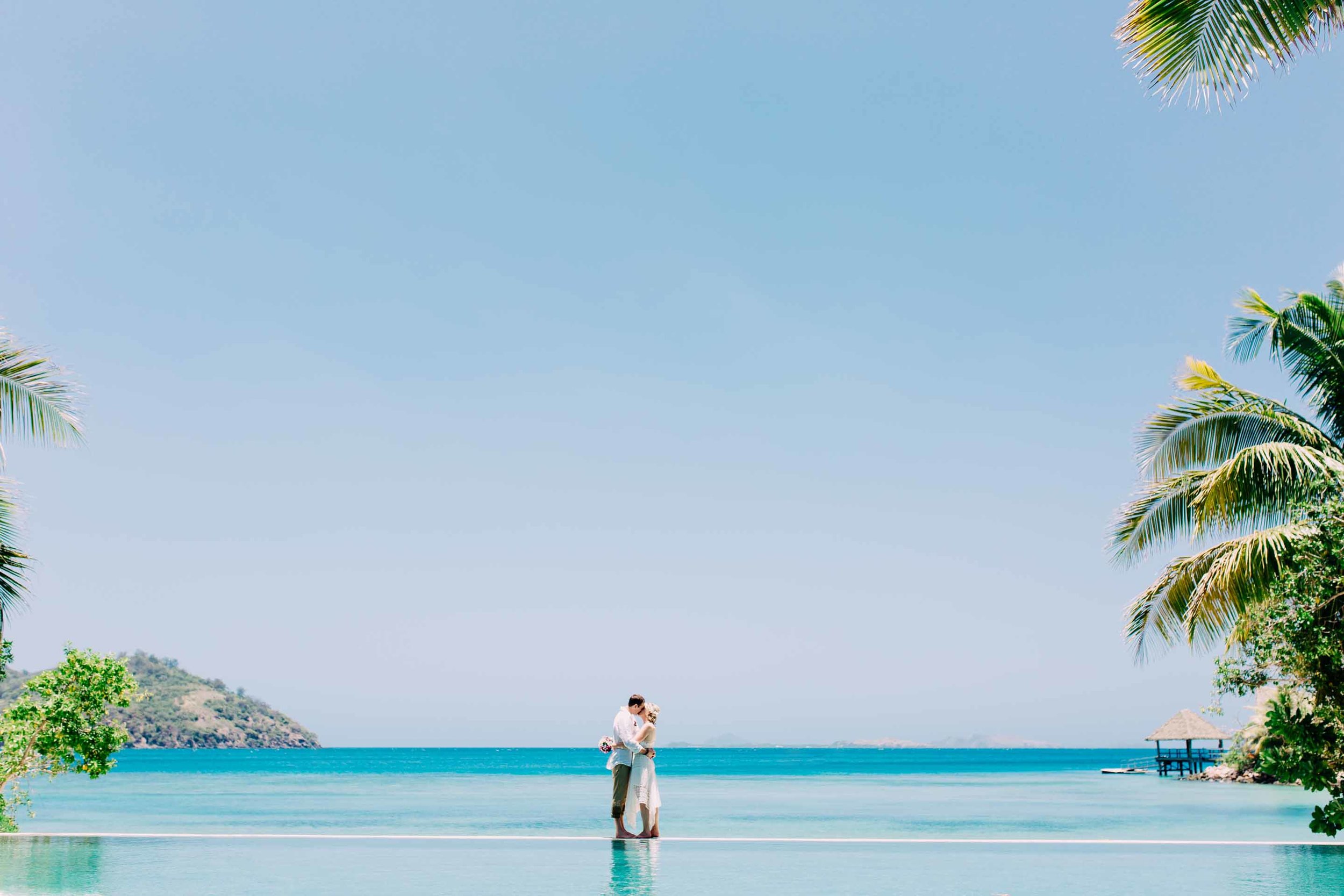 the couple standing on water at Likuliku island resort