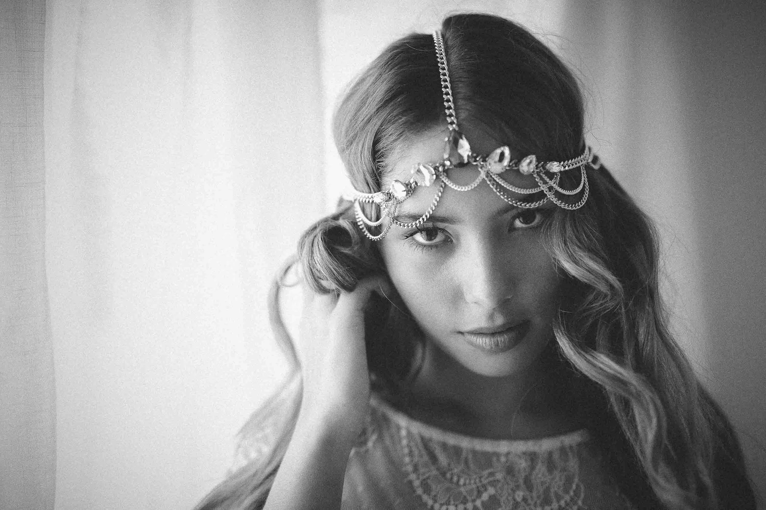 model with silver headpiece in hotel suite