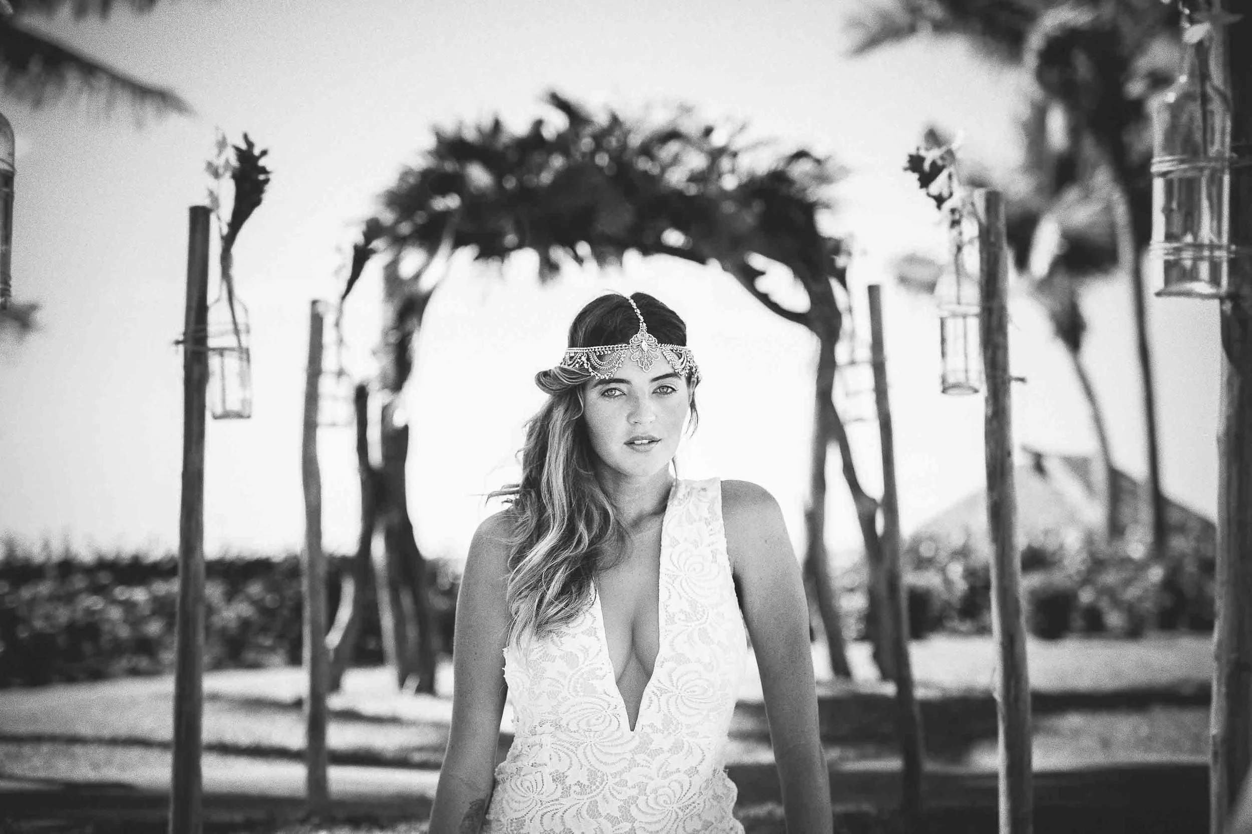 model with silver headpiece at a outdoor wedding setup