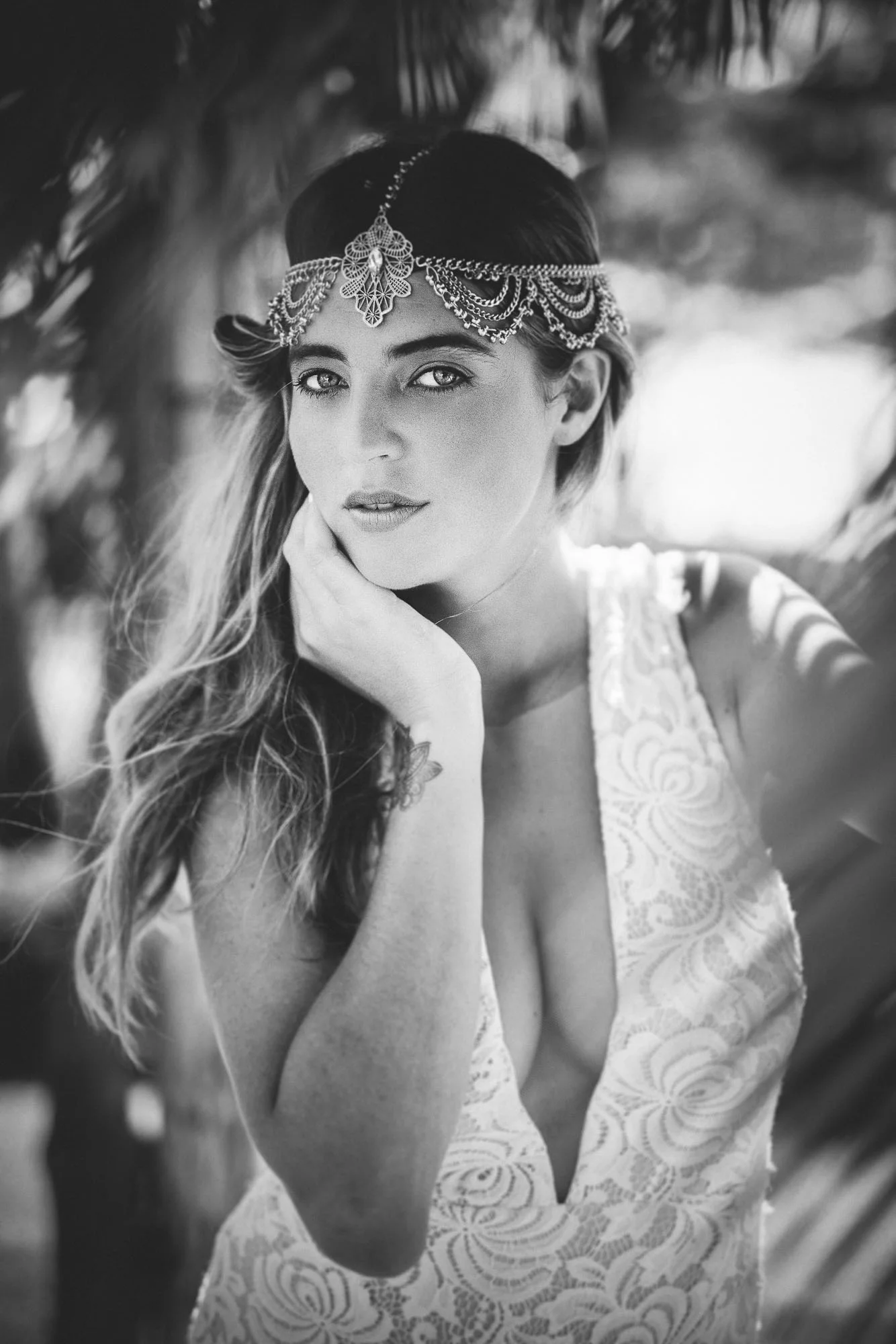model posing under driftwood arch wearing Frankly My Dear headpiece