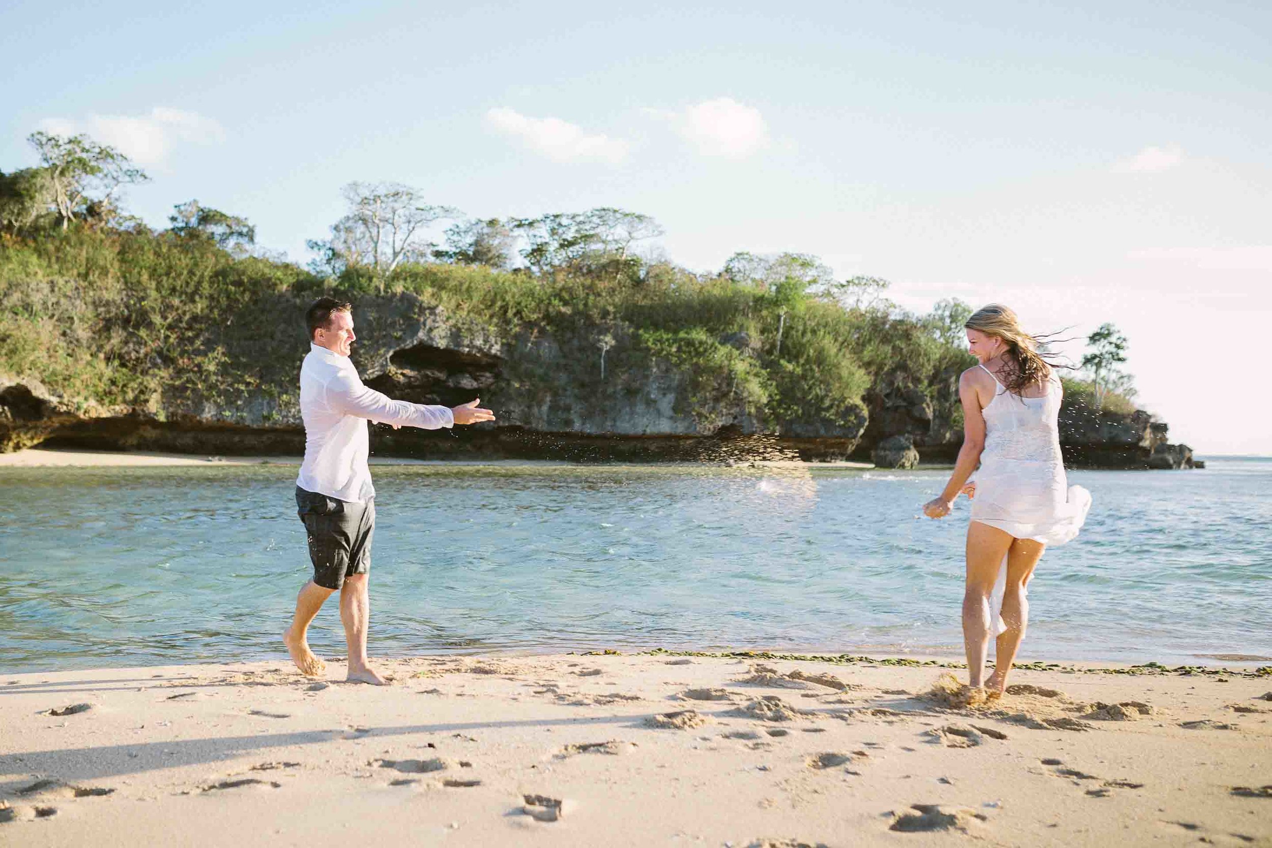 couple playing with sand