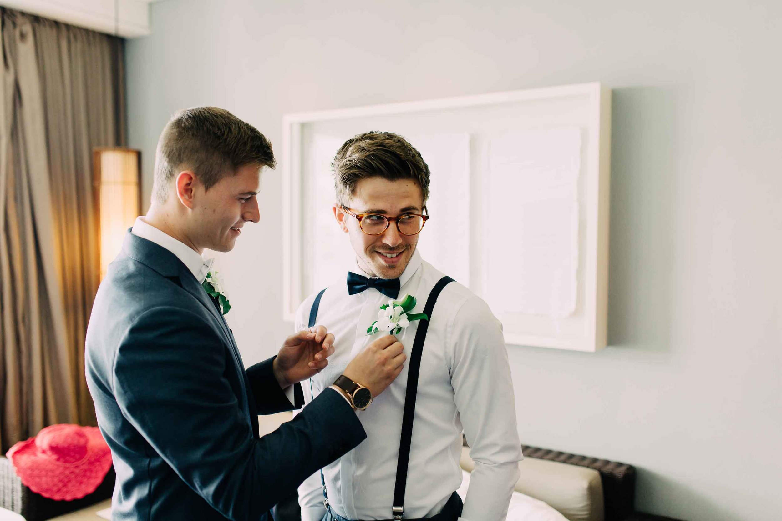 Groomsmen put on the final touches.
