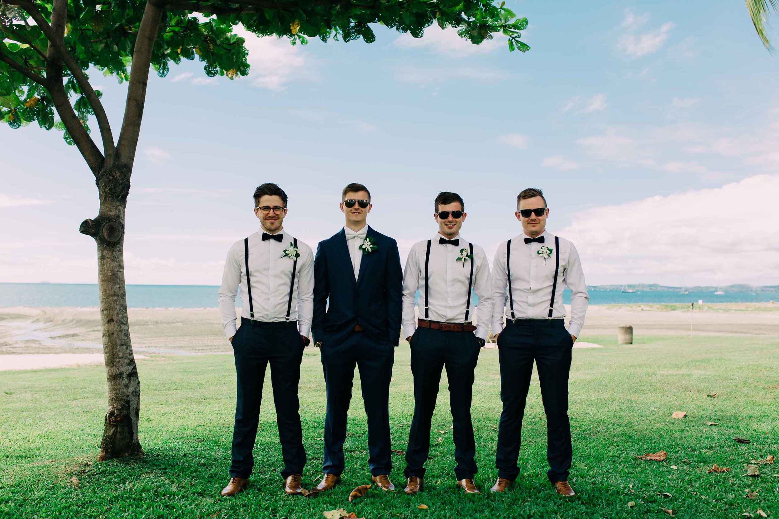 Stylish Groomsmen with Suspenders all ready for the Beach Ceremony at the Hilton Fiji. 