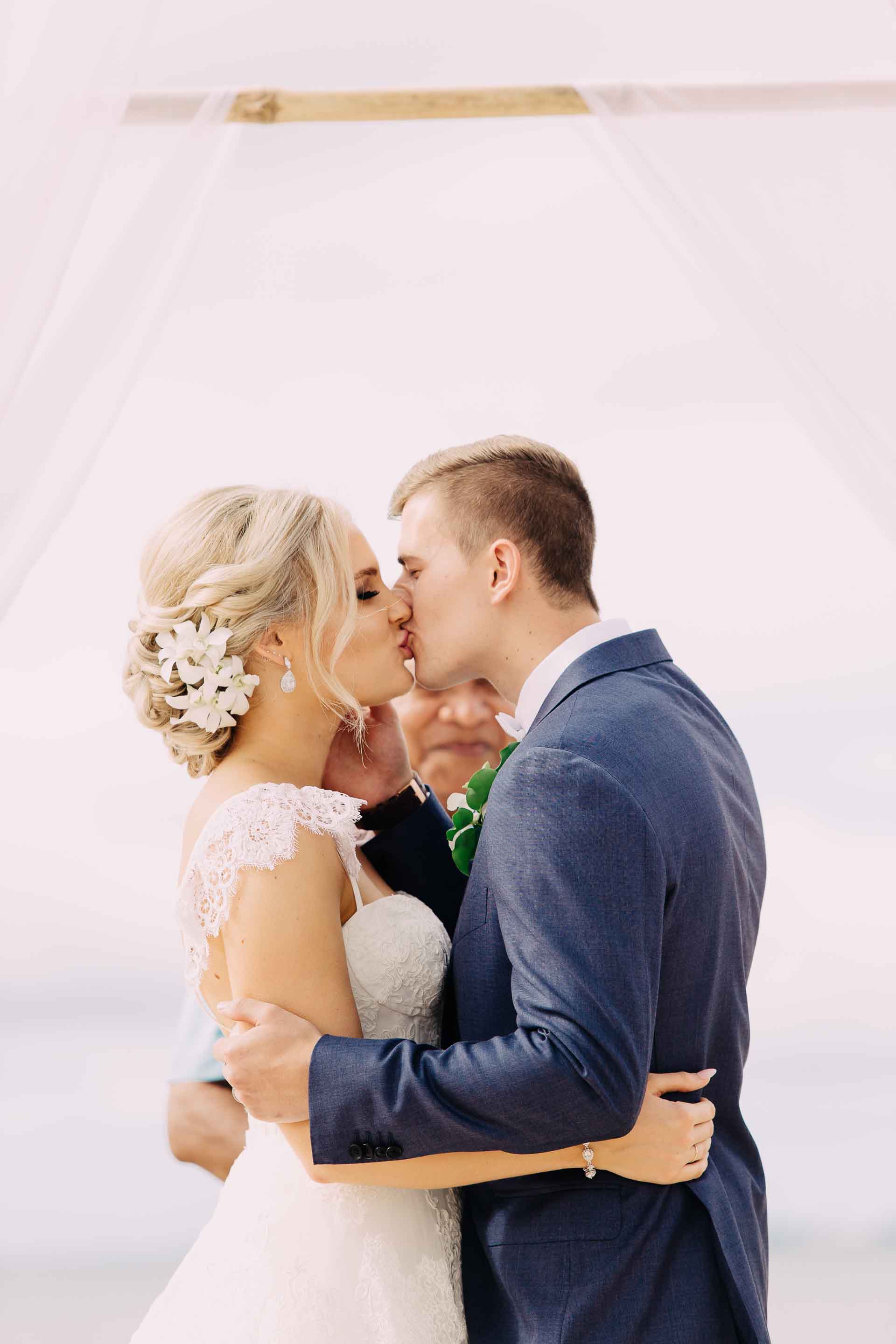 The happy bride and groom have their First Kiss as husband and wife.