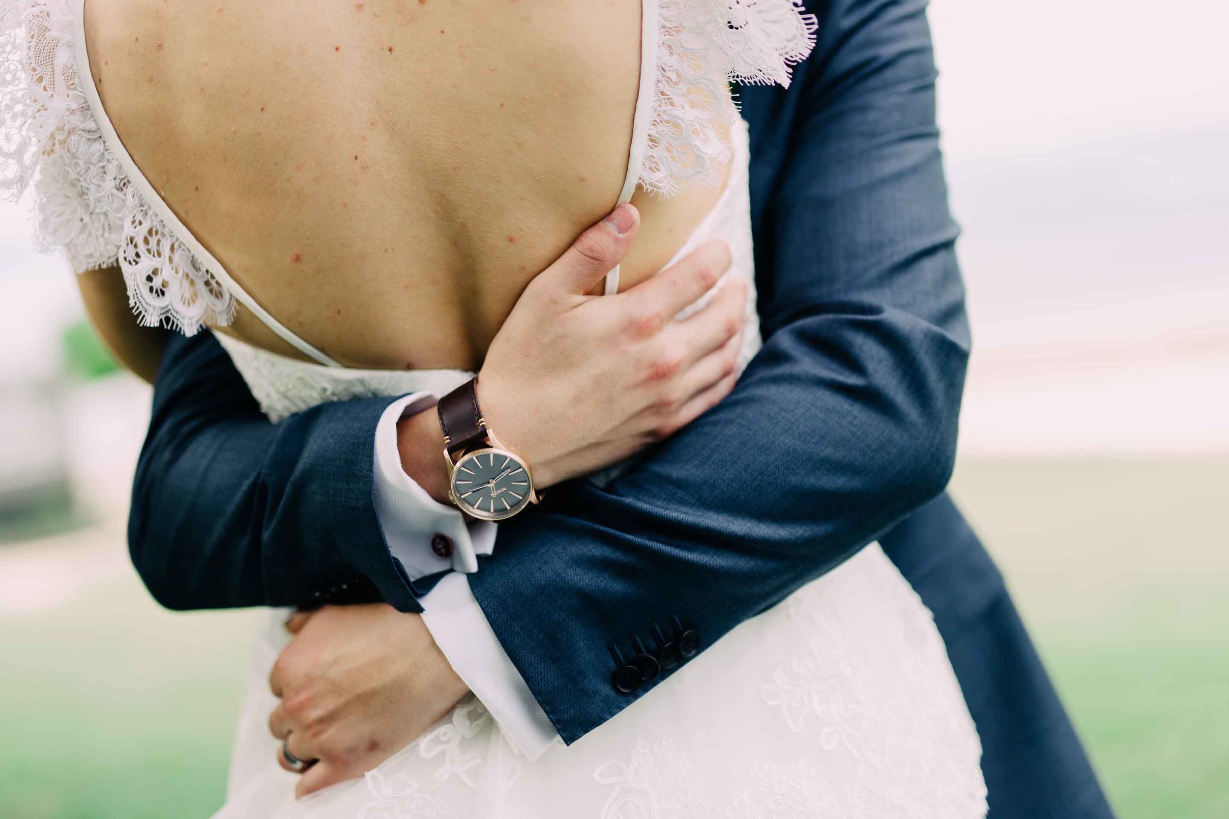 Groom embraces his new and beautiful wife after their Hilton Fiji wedding. 