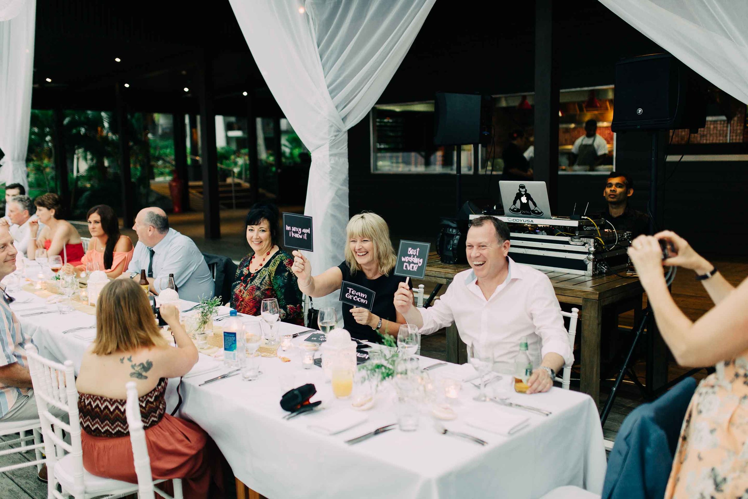 Guests celebrate at Fiji wedding reception. 