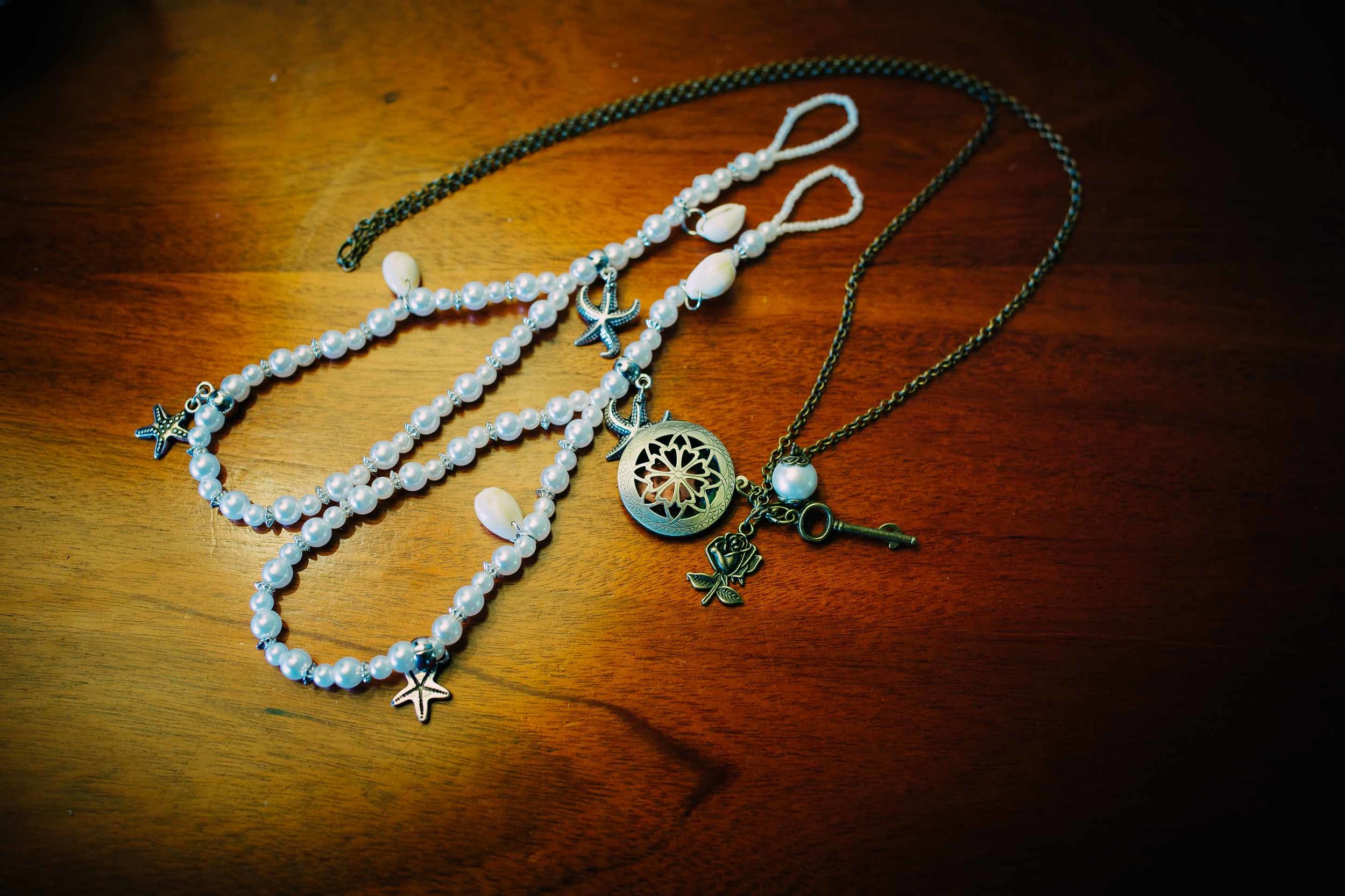 the bride's jewellery on a wooden table