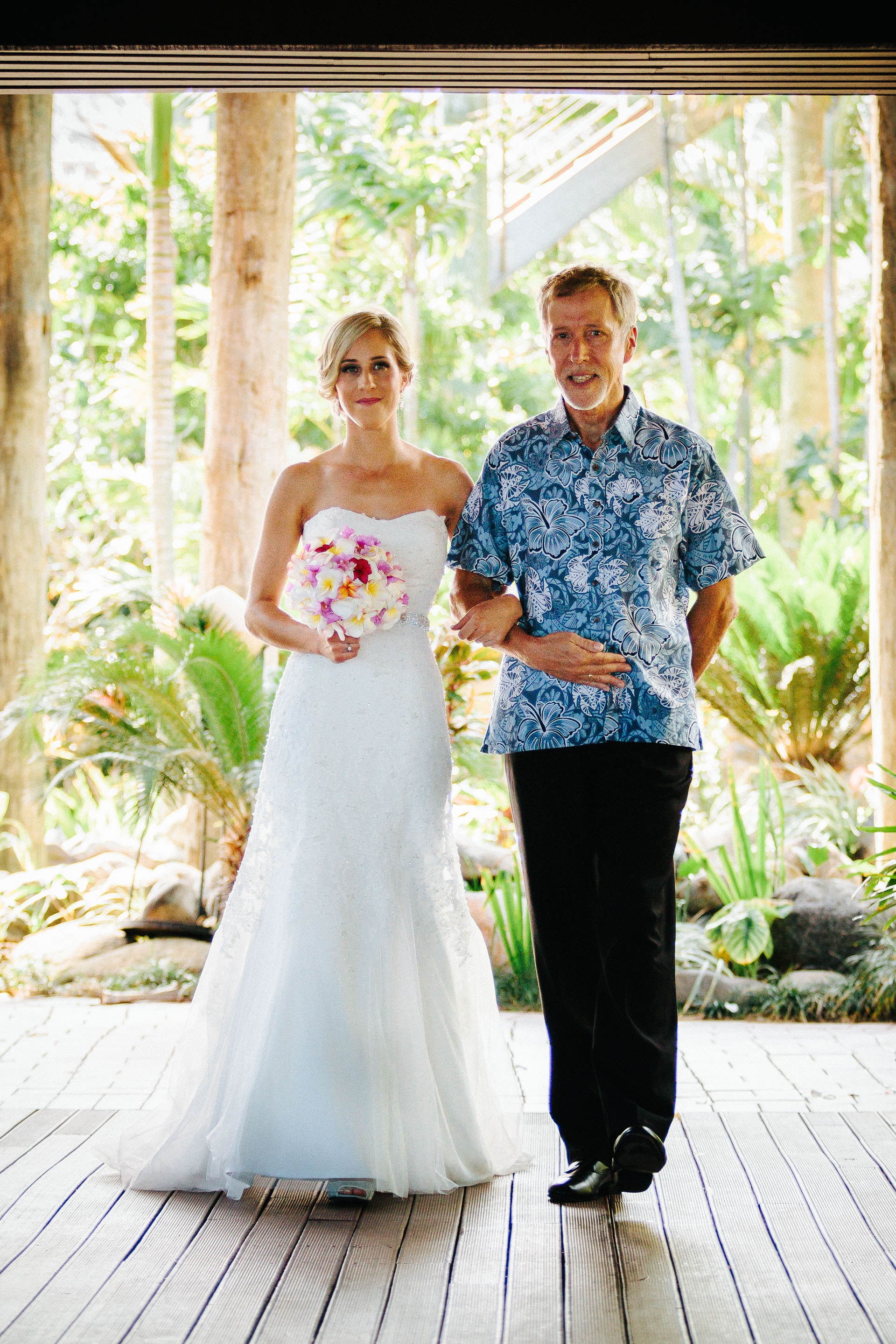 Bride being walked down the aisle by her father