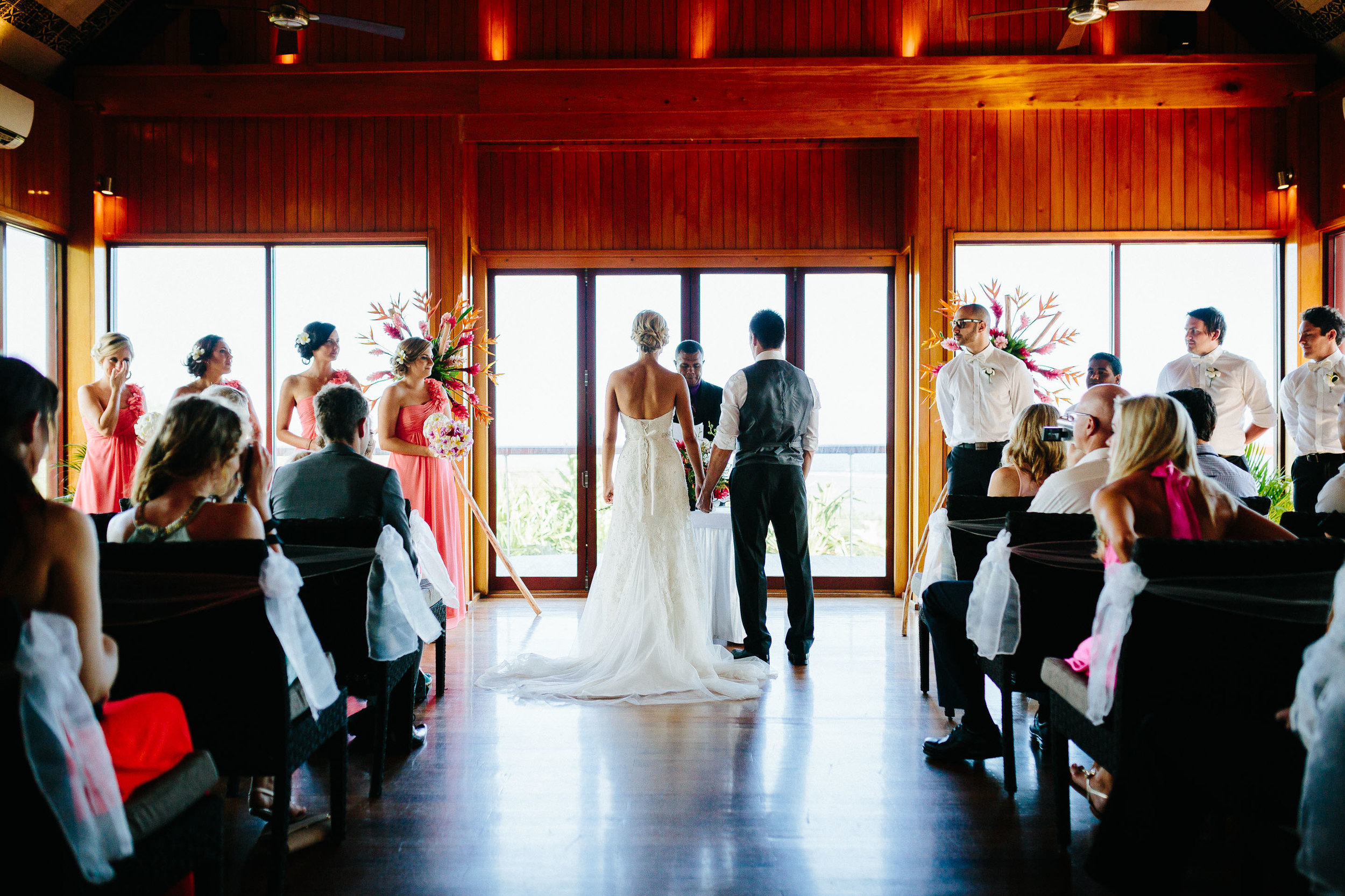 Bride and groom holding hands during ceremony