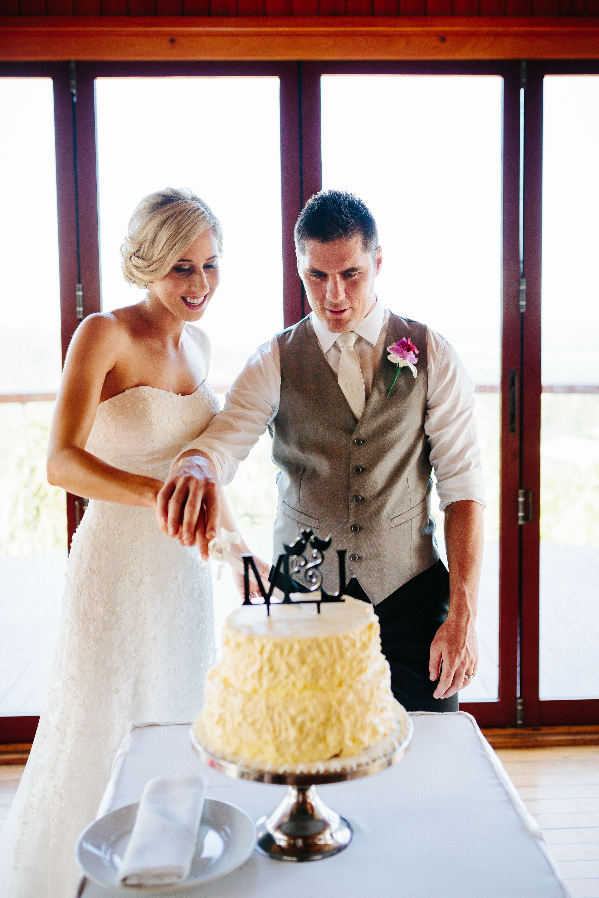 Newlyweds cutting the wedding cake