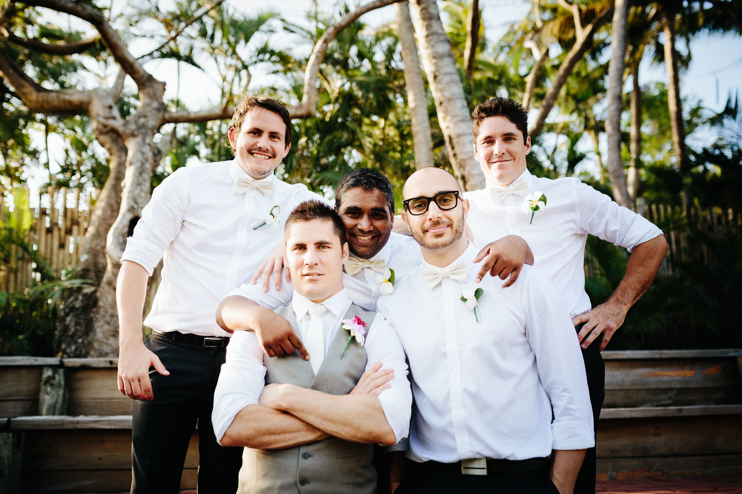 groom and groomsmen posing for a photo