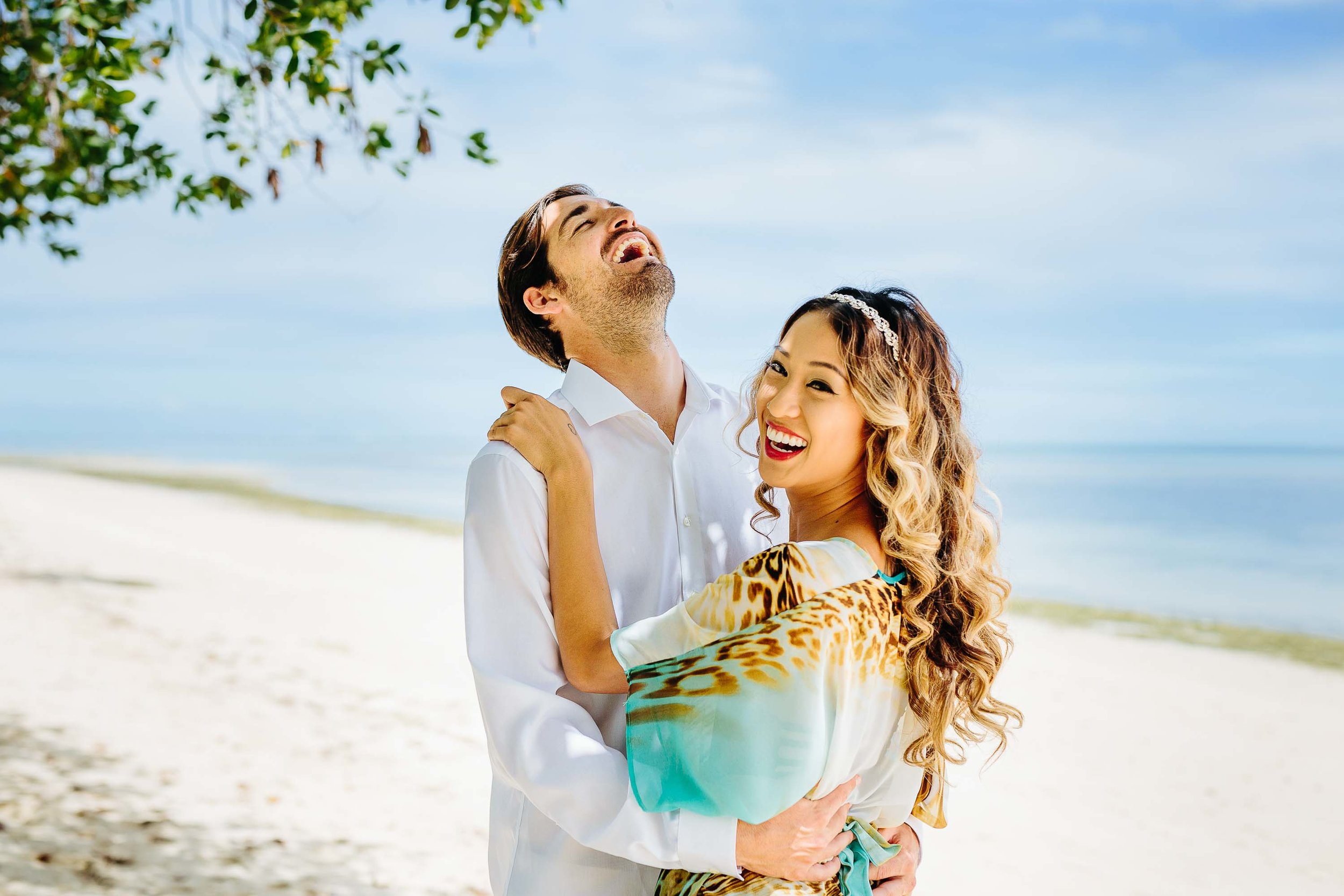 bride and groom laughing