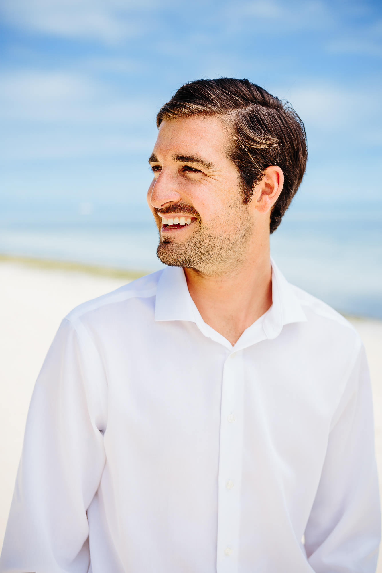 groom portait on the beach