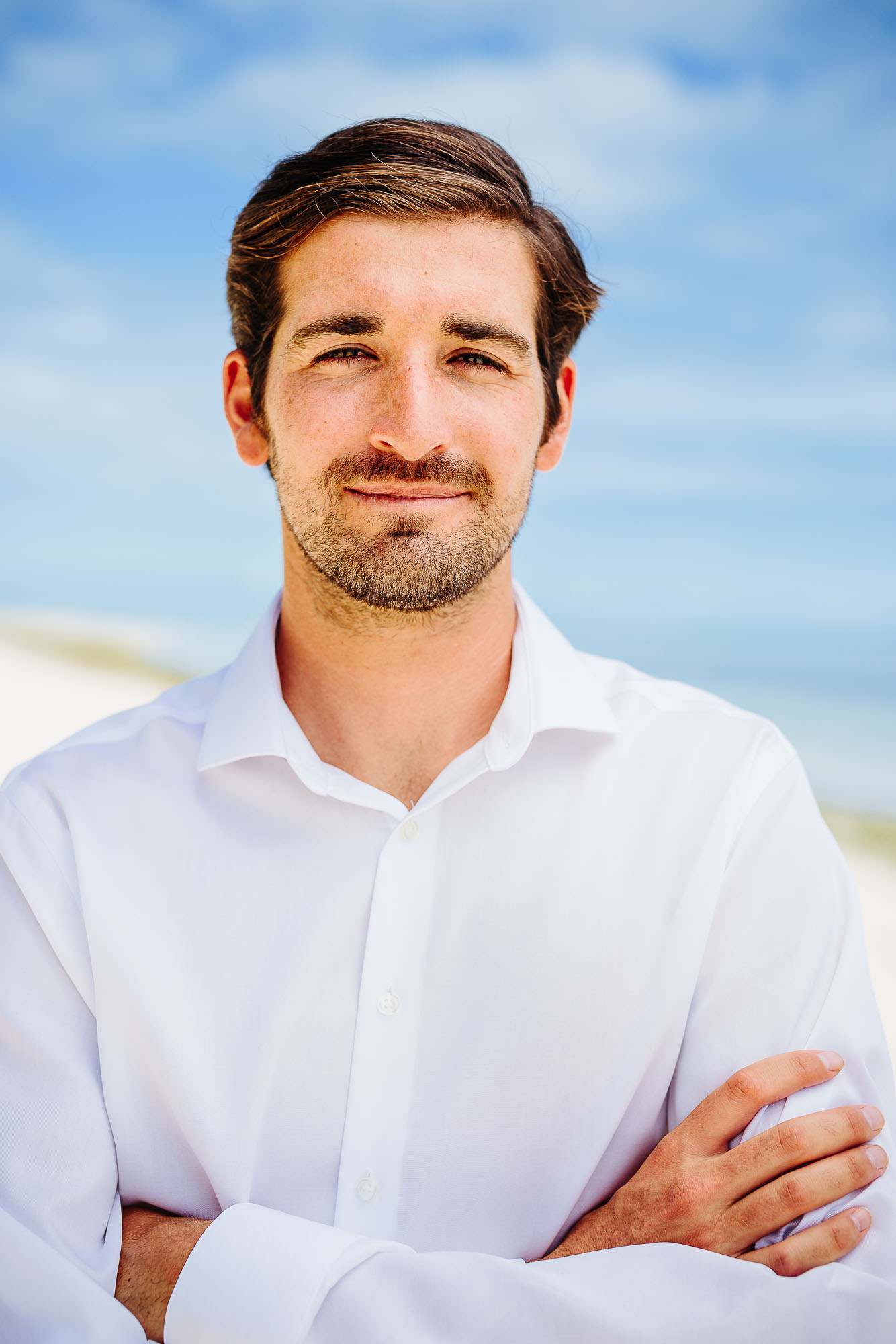 groom portait on the beach