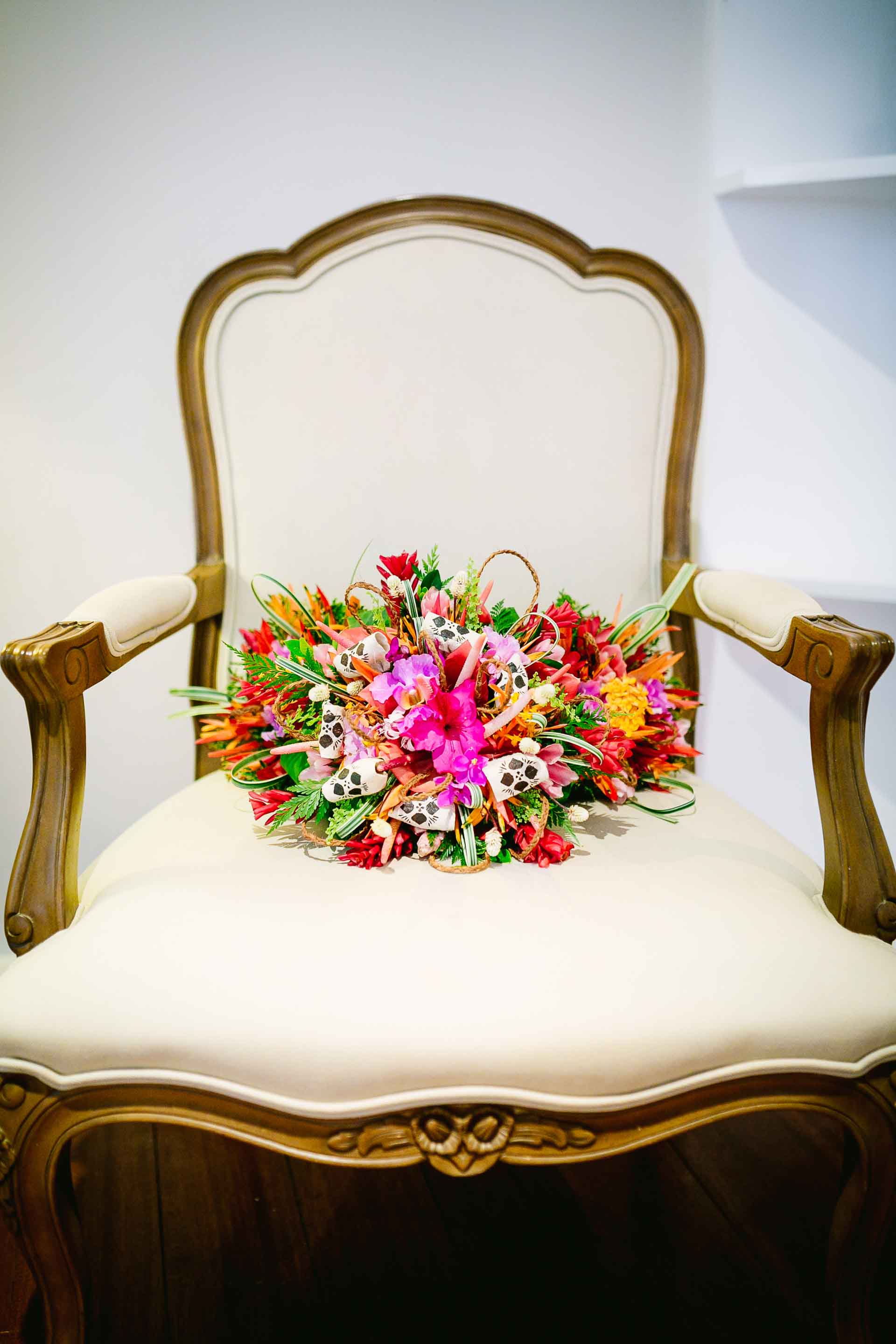 bridal bouquet placed on an antique chair