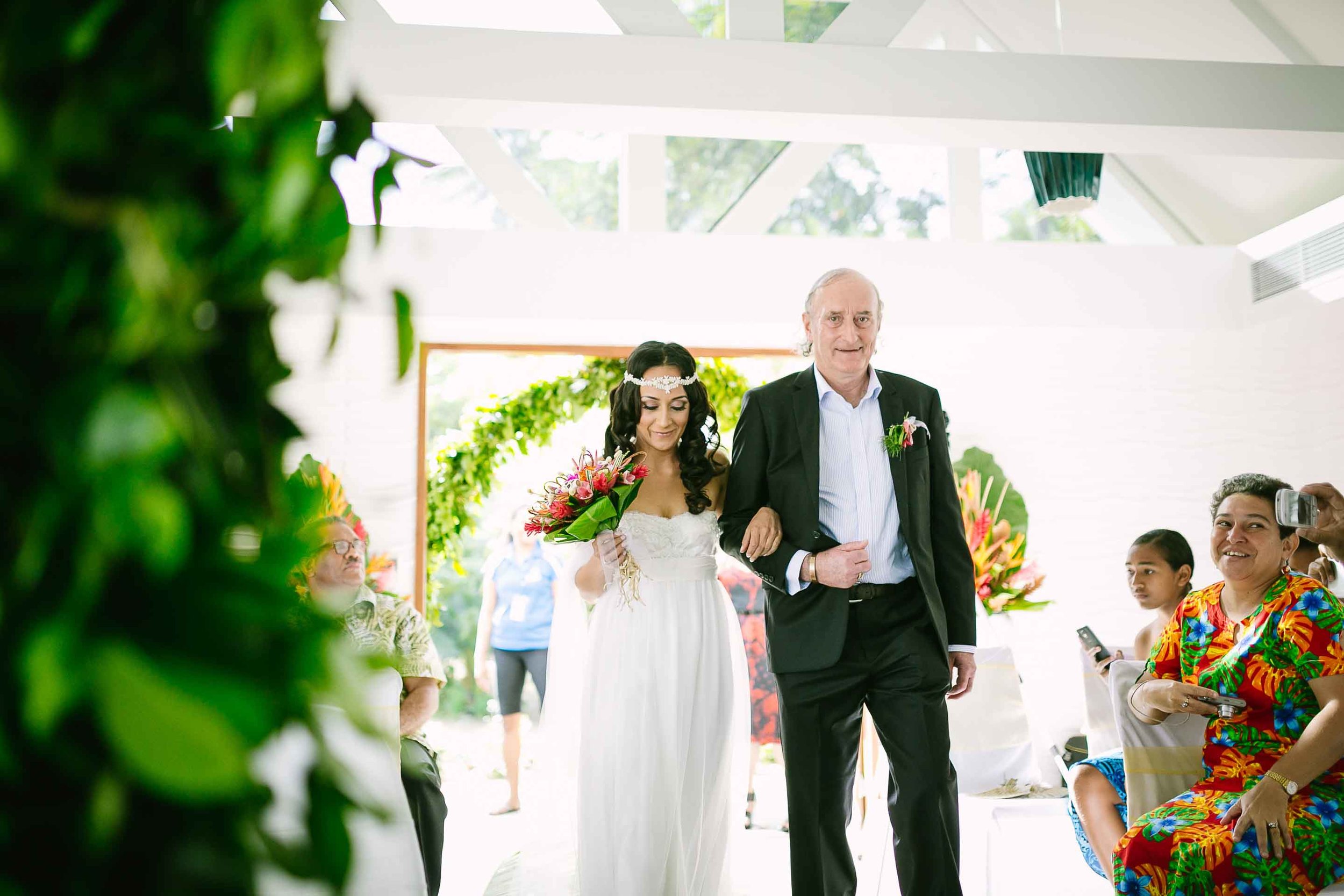 father and daughter walking down the asile