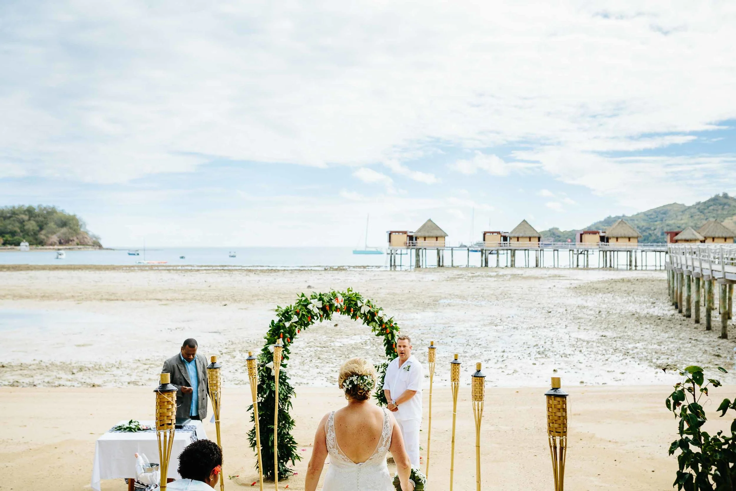 the bride walking down the aisle to her waiting groom