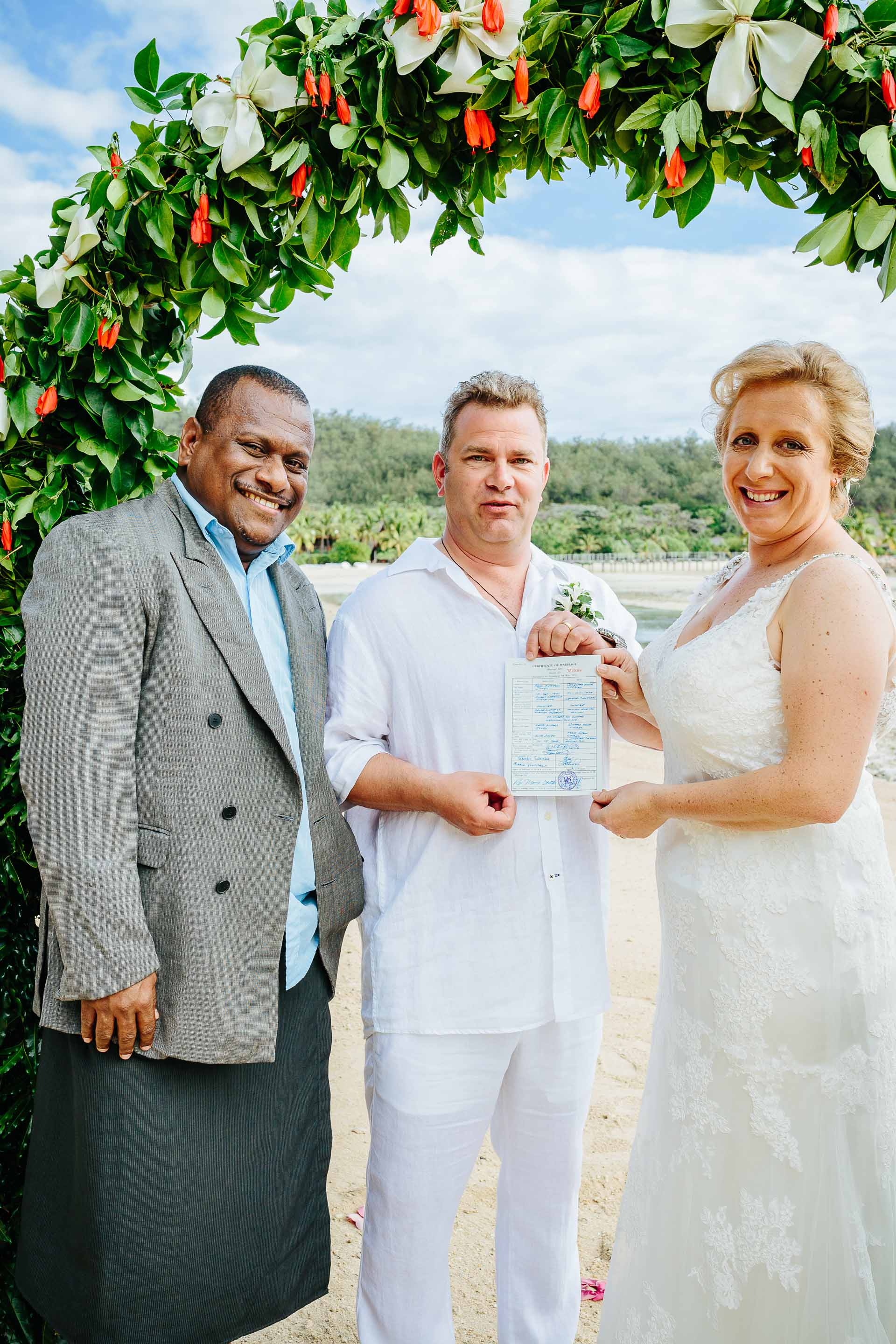 the celebrant presents the certificate of marriage