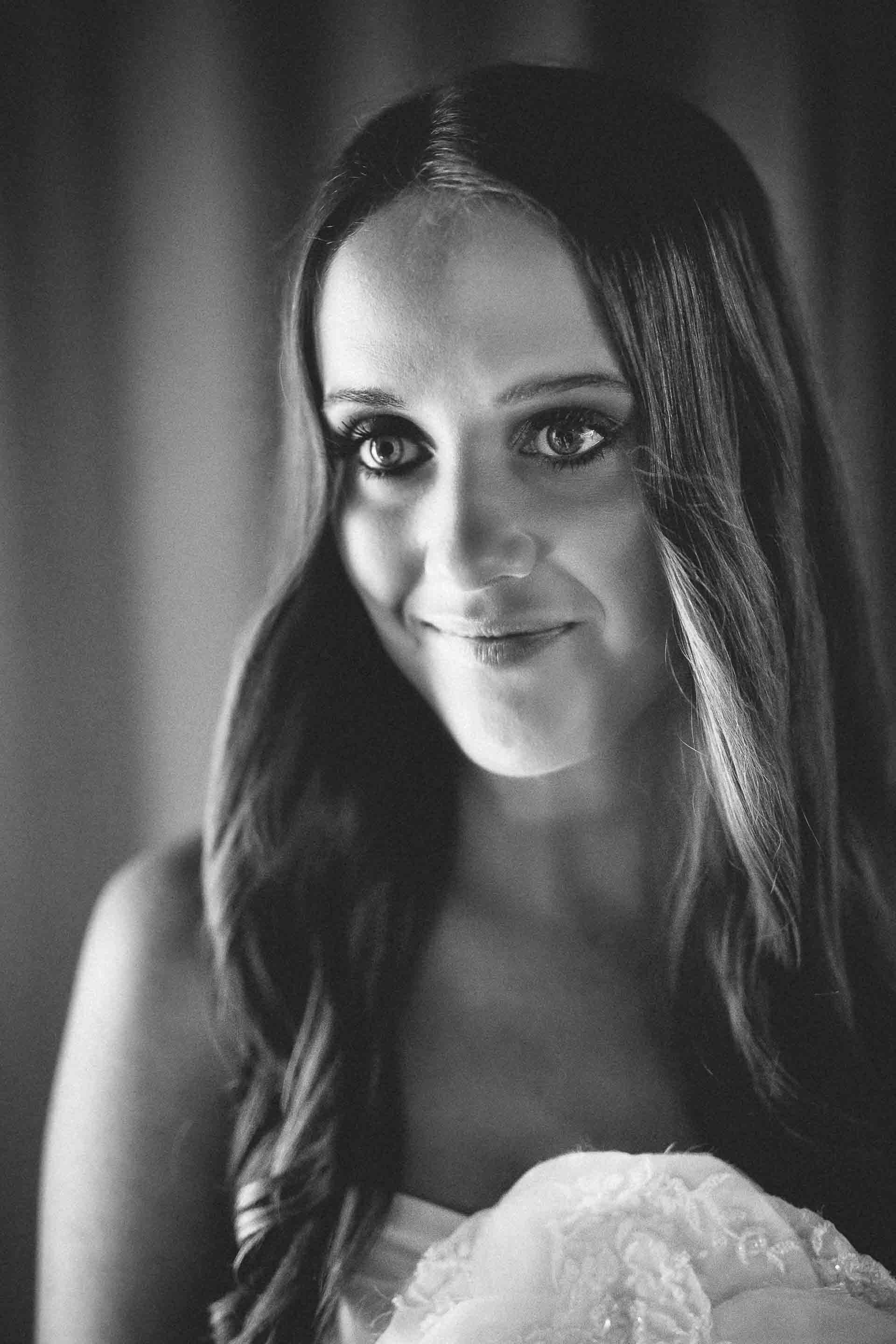 closeup portrait of the bride in black and white once she is all ready