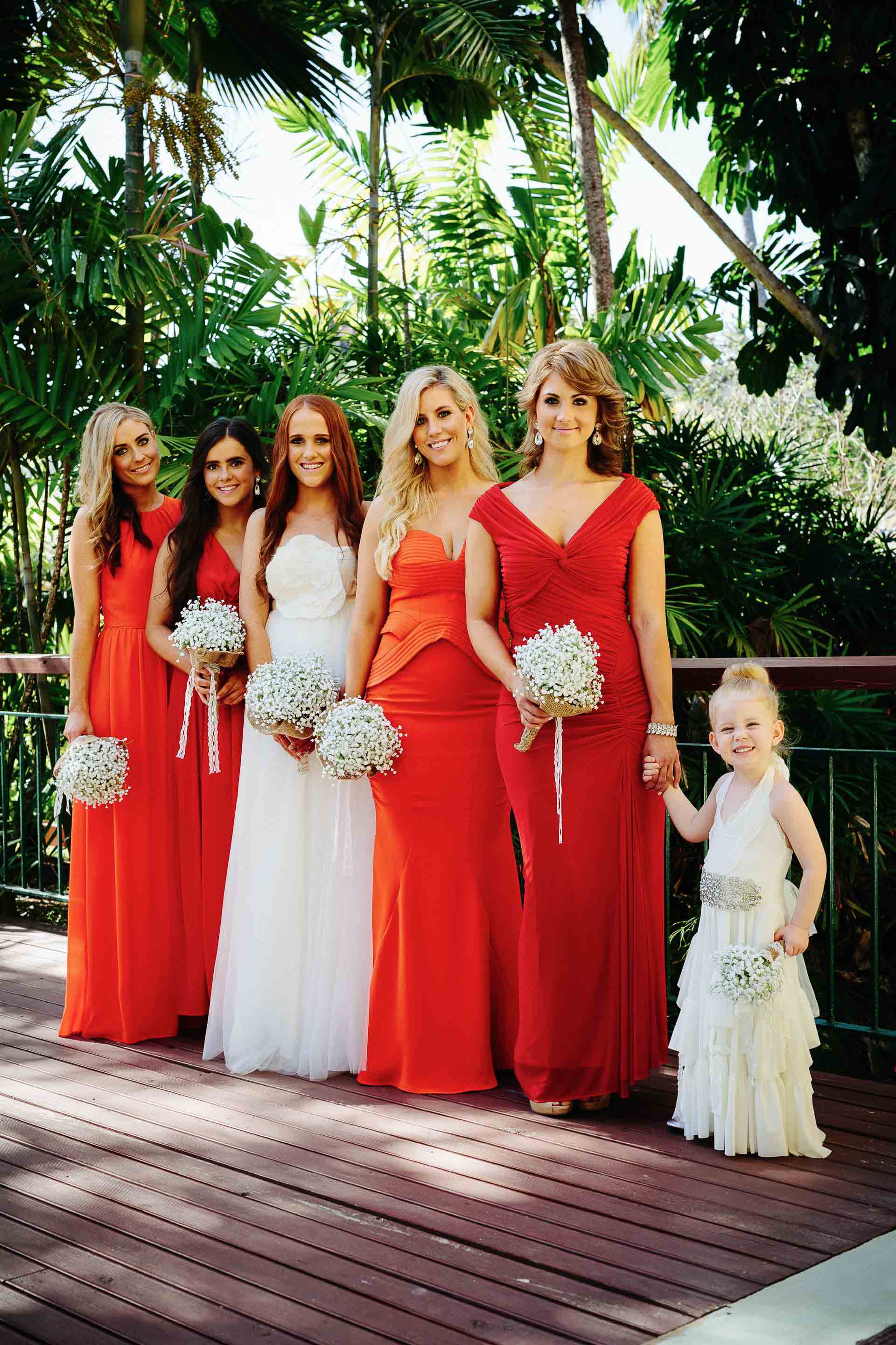 the bride and her maids waiting outside for the buggies to take them up to the chapel