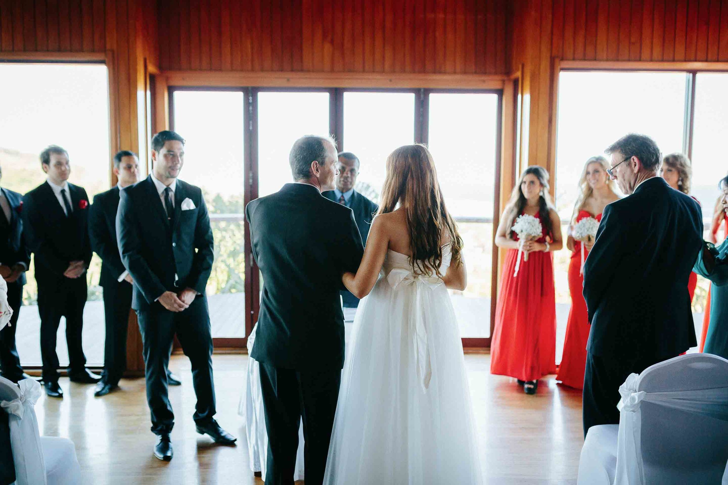 father of the bride giving his daughter away