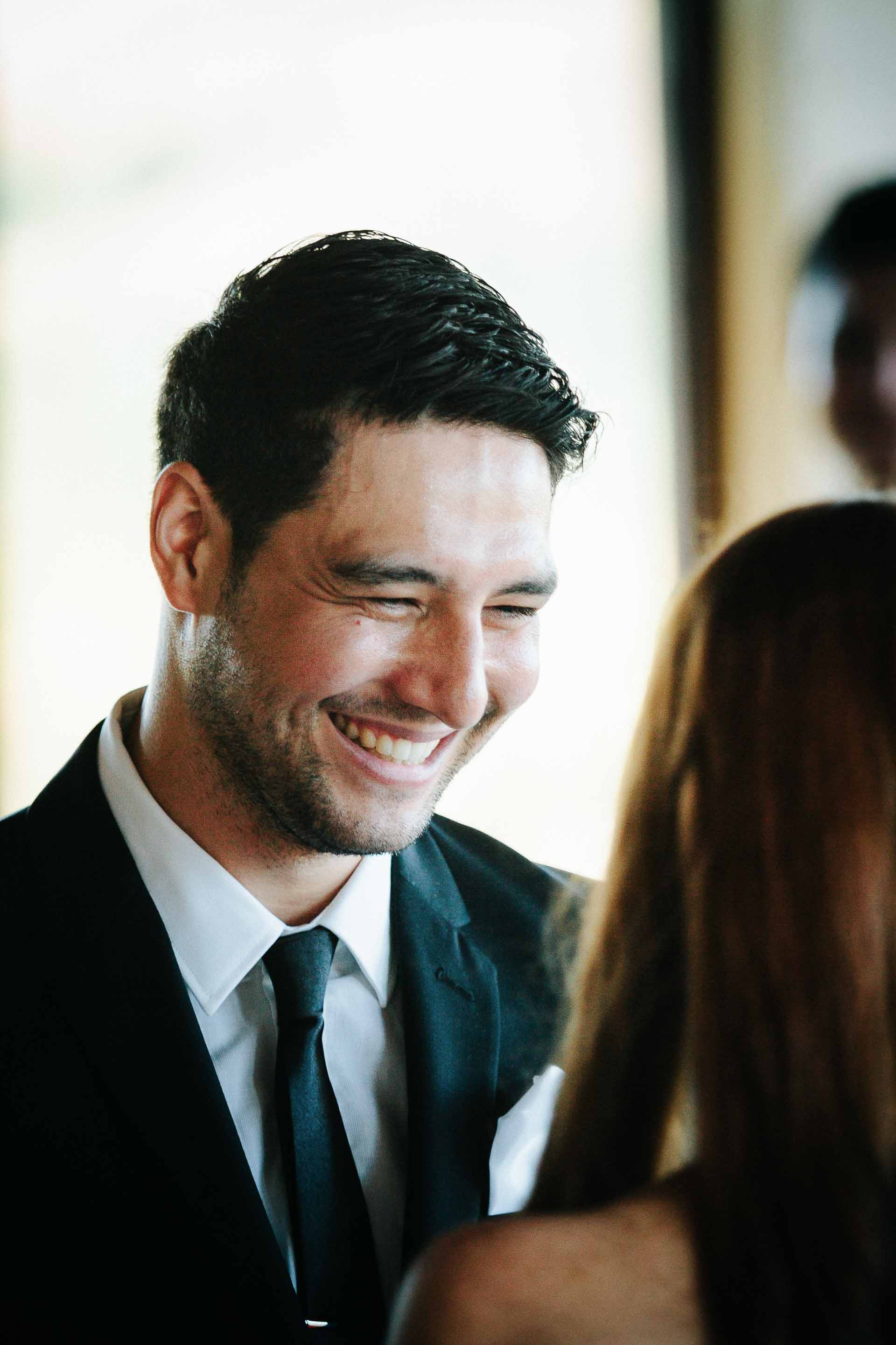 close up of the groom during the ceremony