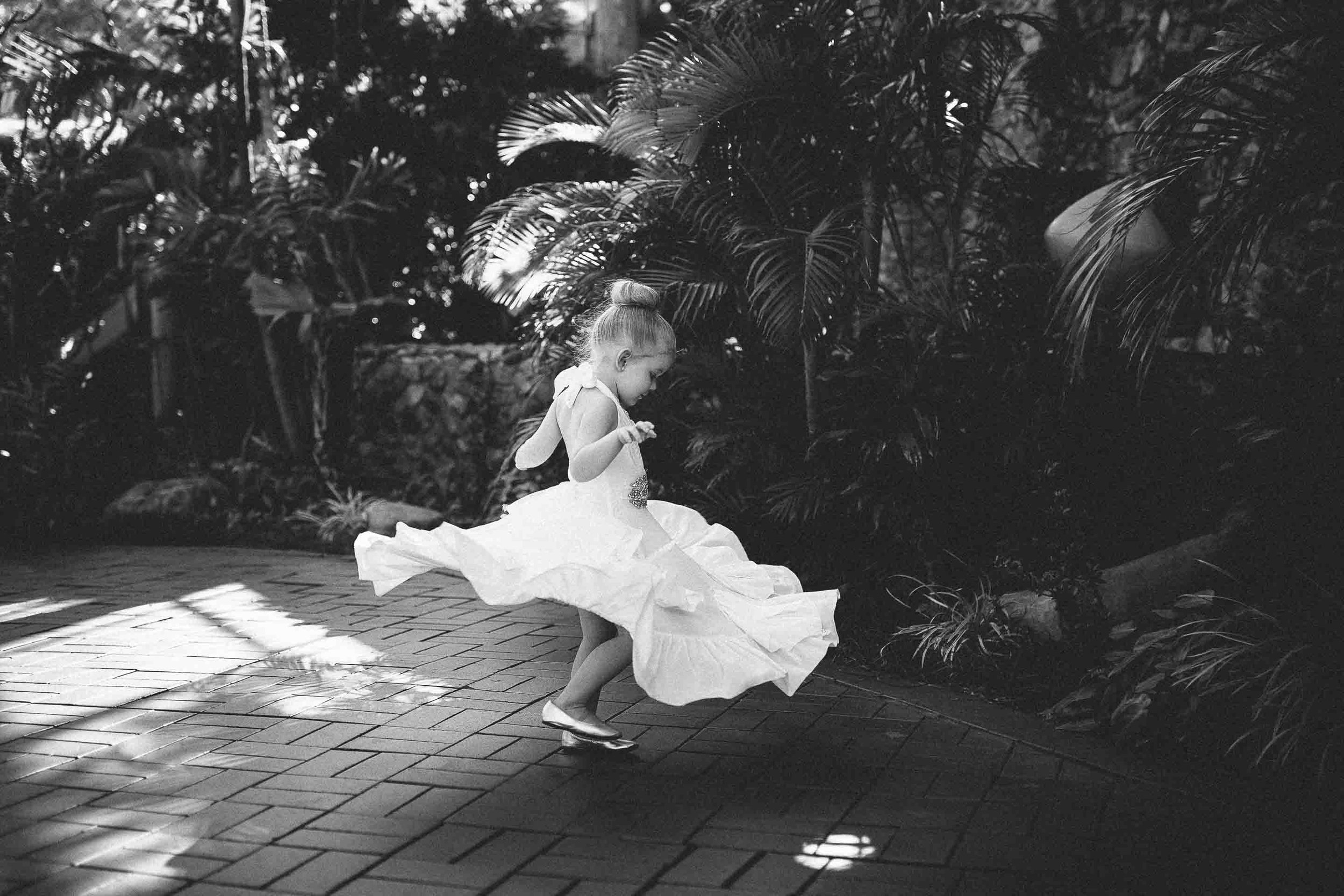 the flower girl spinning around as fast as she can