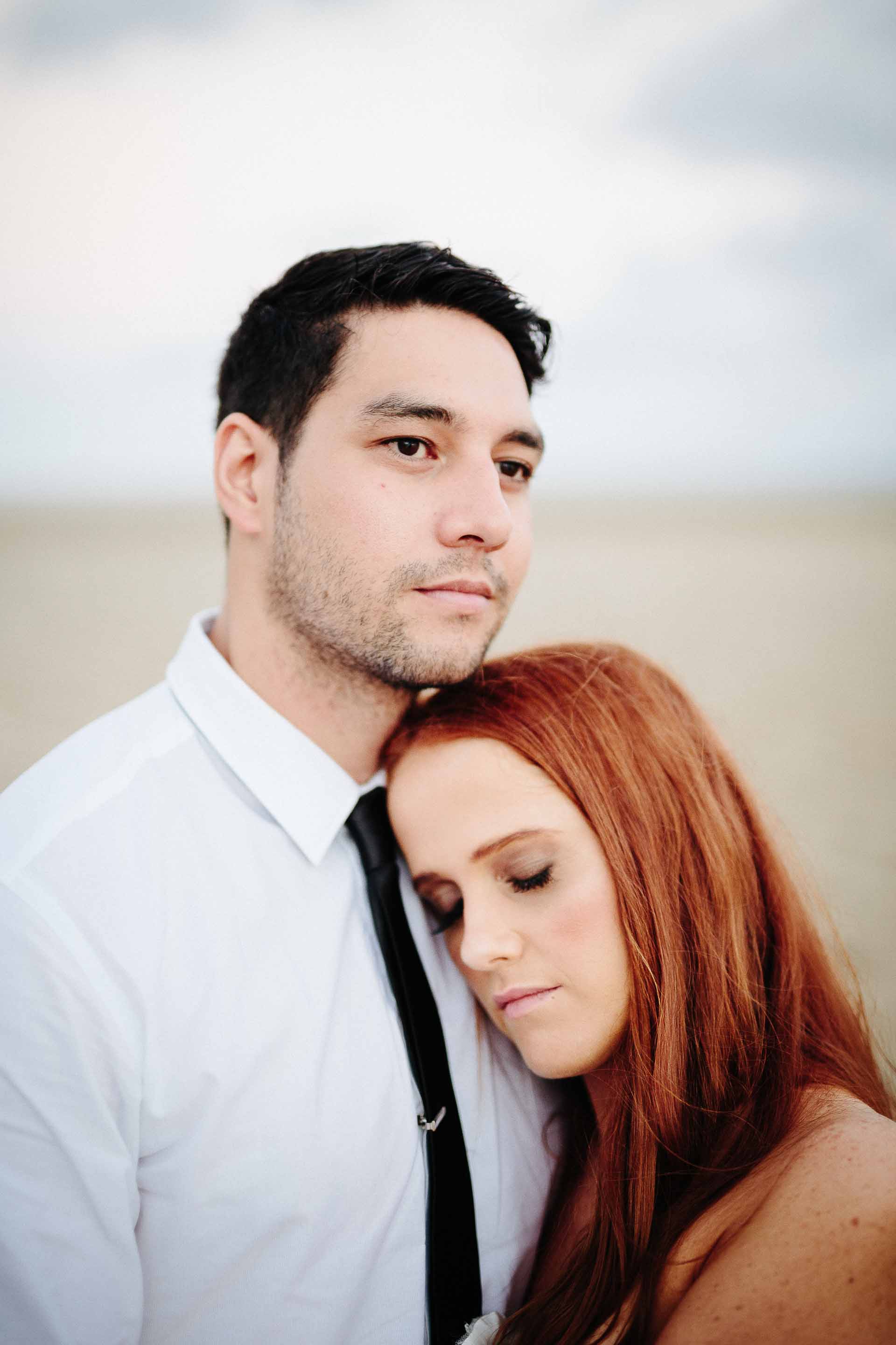 bride resting her head on her grooms chest